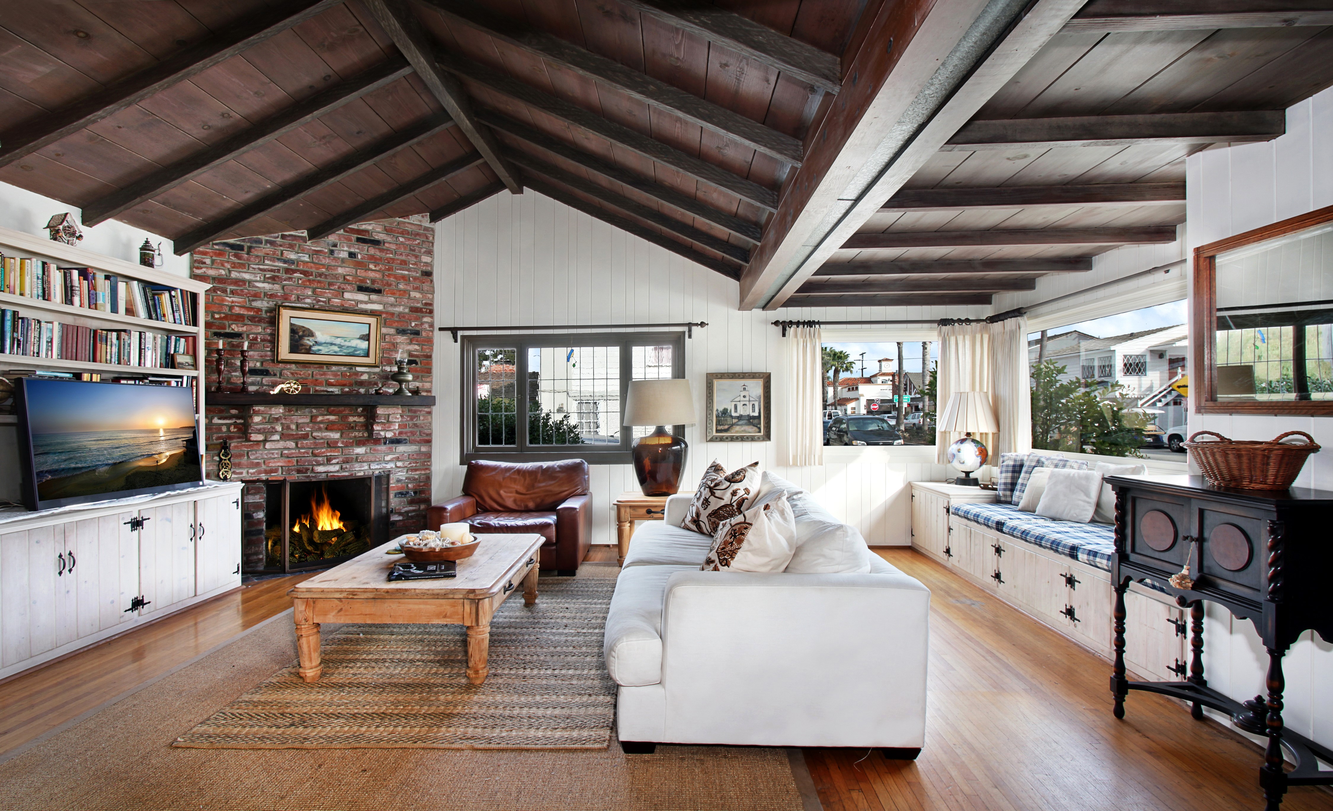 Living room with fireplace and sofa HD Wallpaper