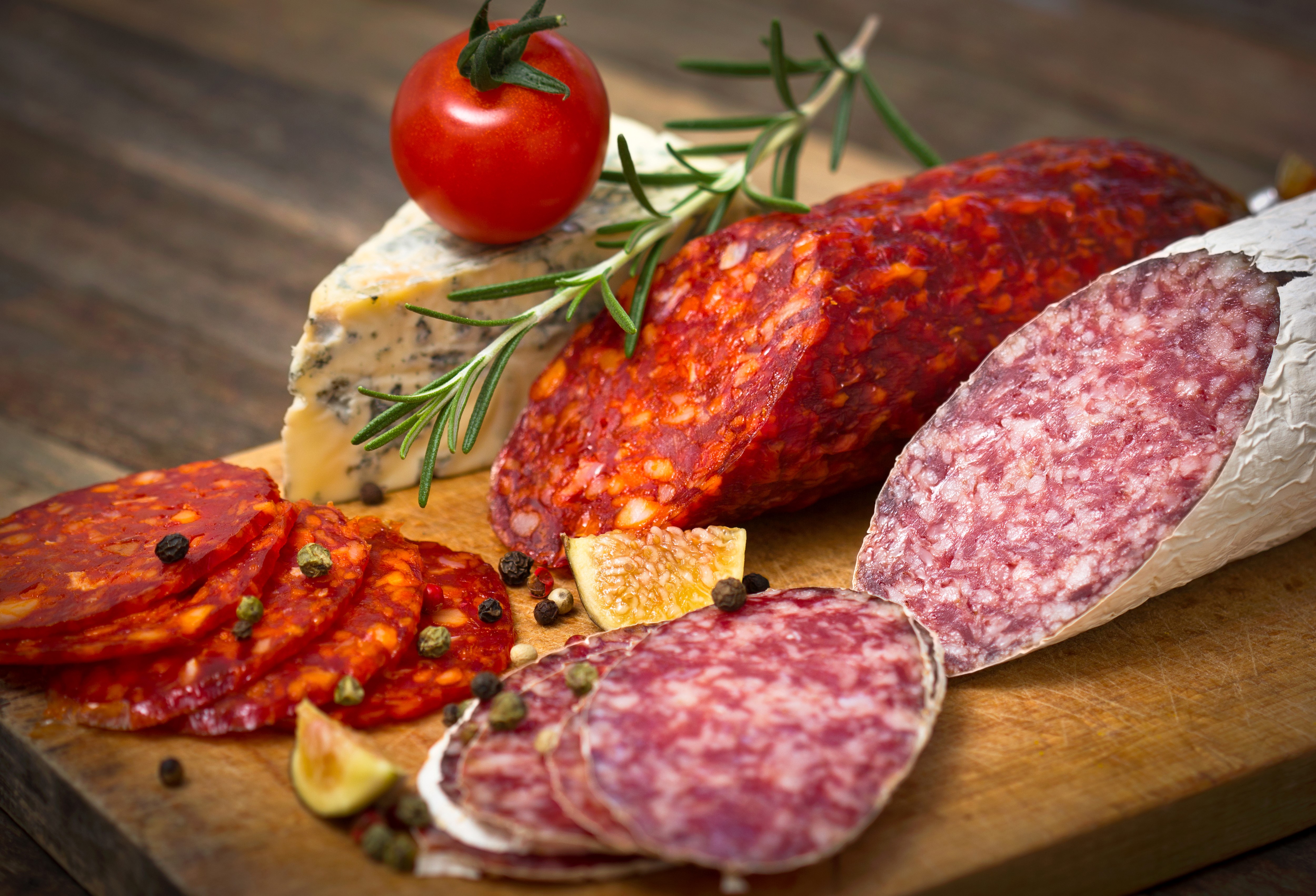 Sausage, Cheese, Tomato, and Spices on a Wooden Board HD Wallpaper