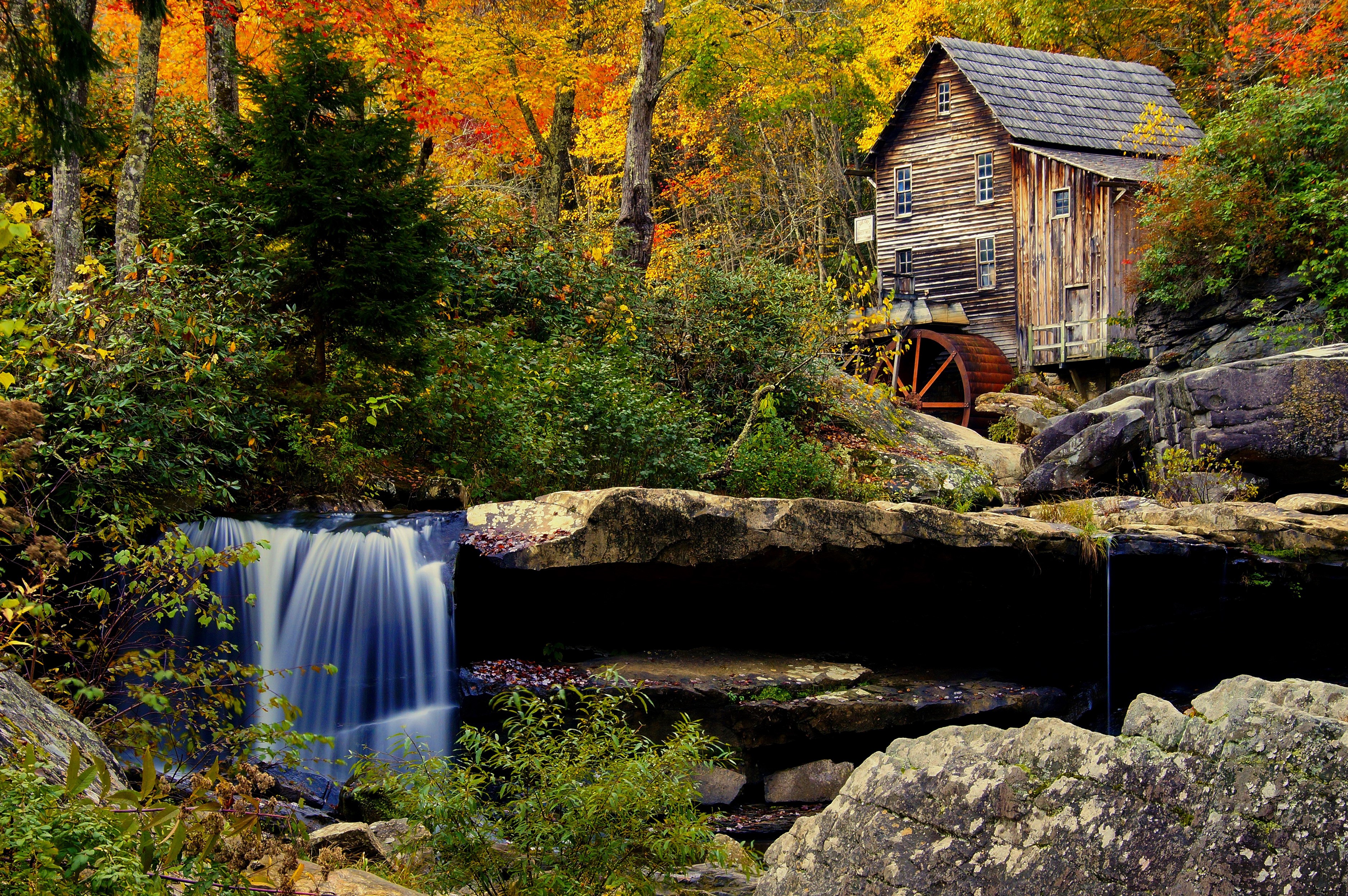 Wooden watermill by a waterfall in autumn forest HD Wallpaper