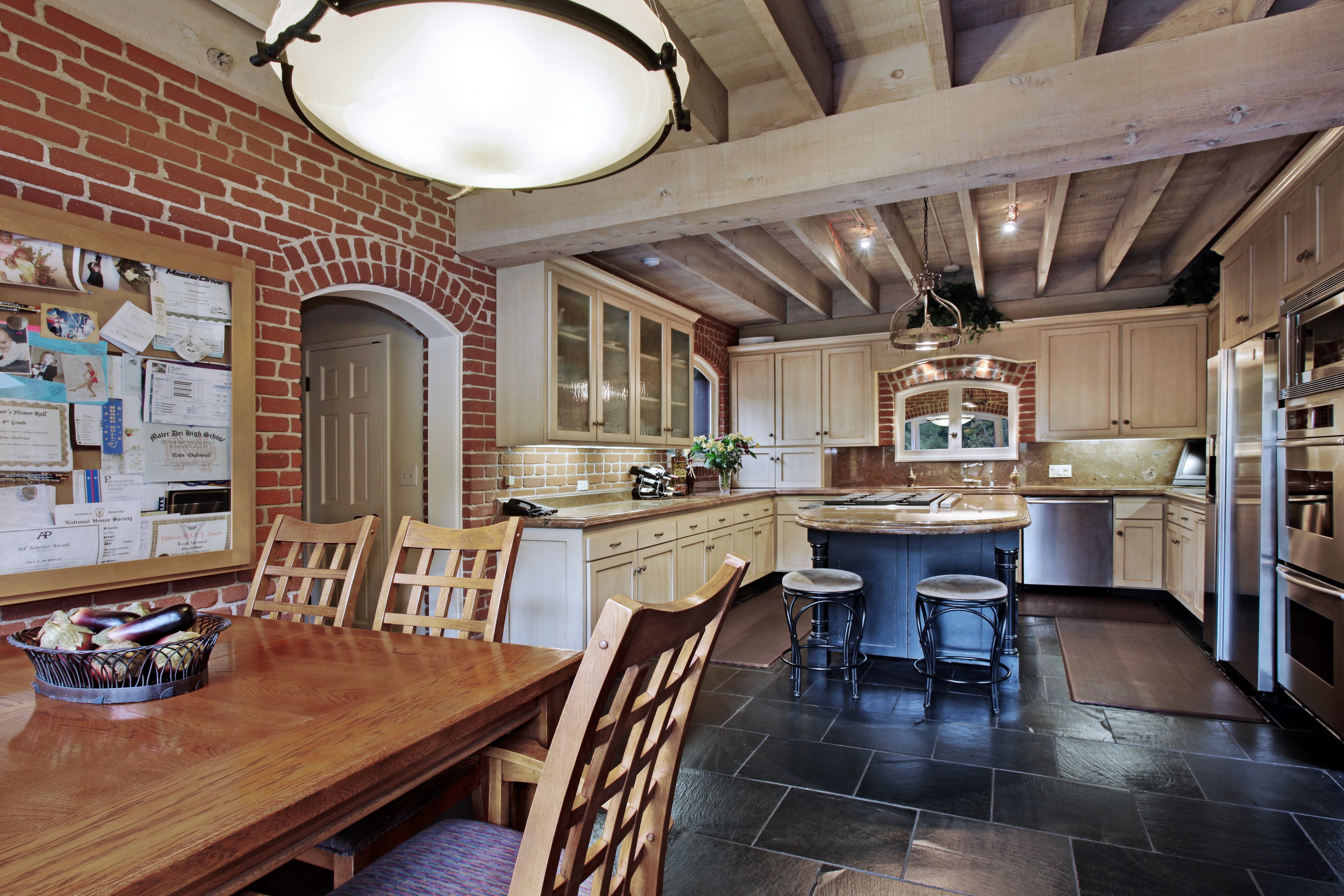 Rustic Kitchen with Brick and Wood Accents HD Wallpaper