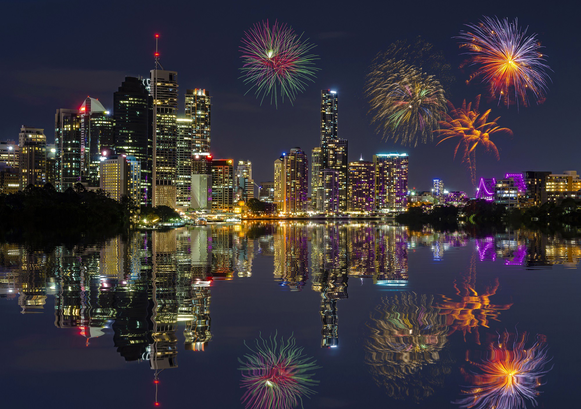Brisbane skyline with fireworks over the river at night HD Wallpaper