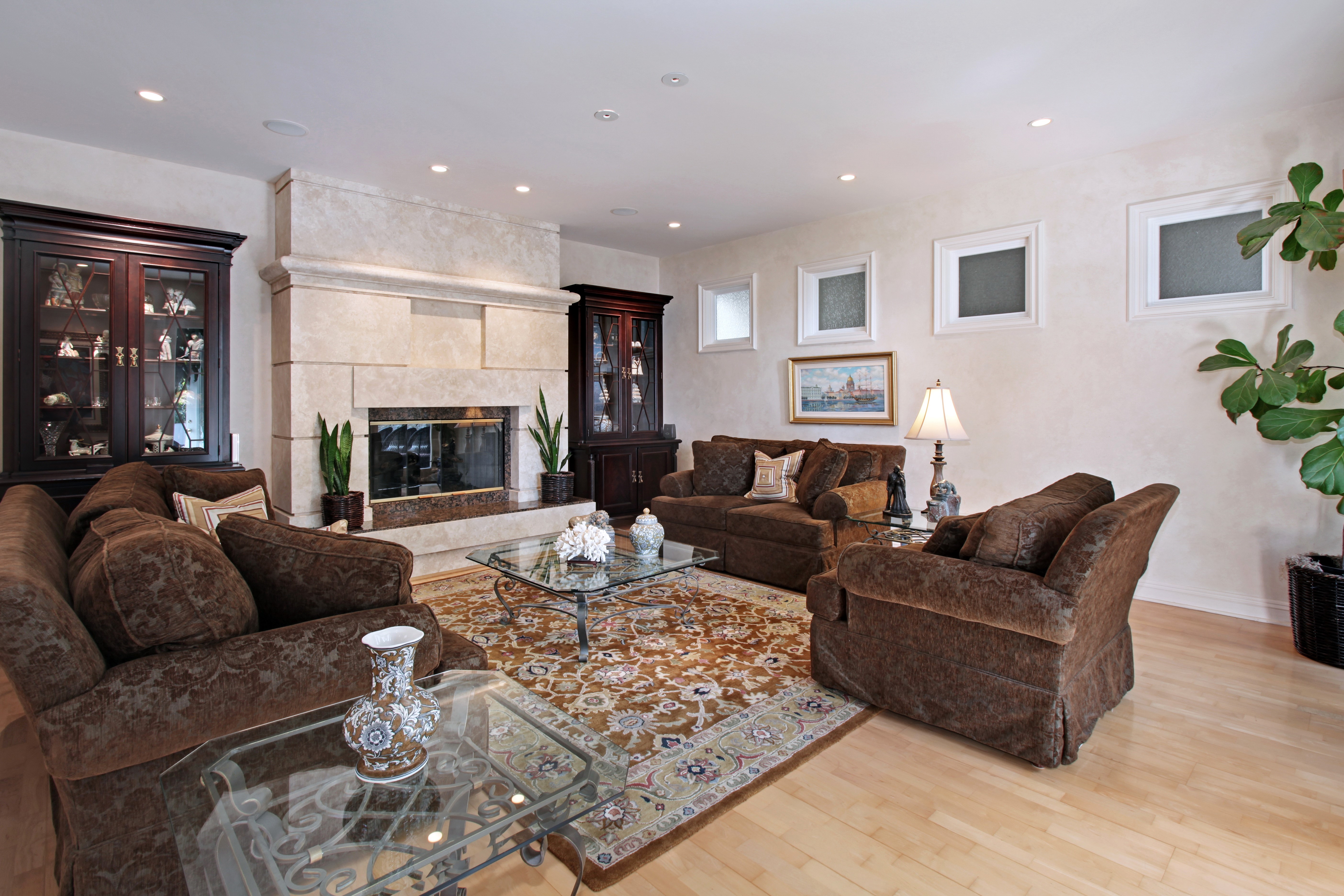 Living room with fireplace, sofas, and armchairs HD Wallpaper
