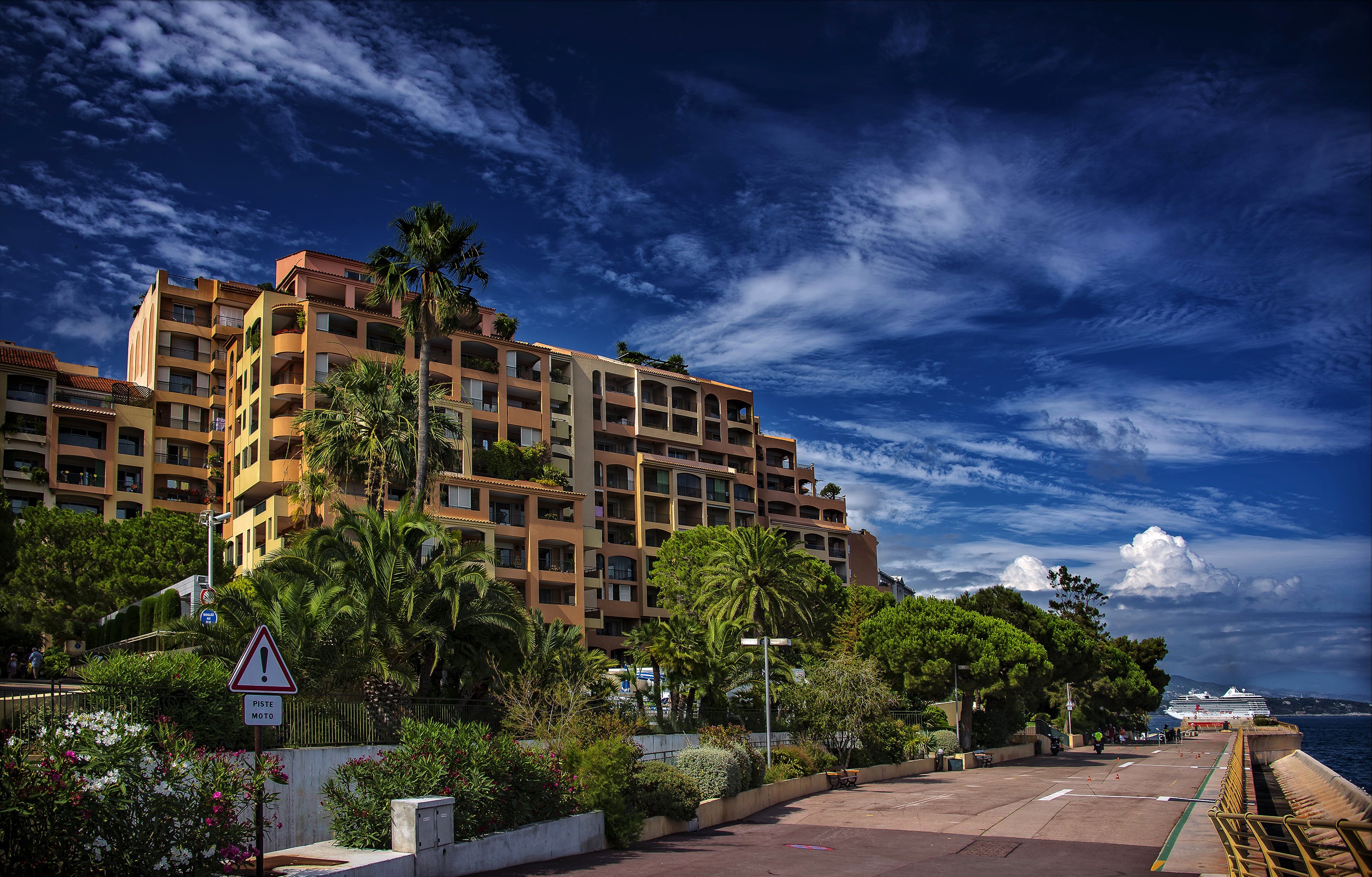 Apartment buildings and palm trees in Fontvieille, Monaco HD Wallpaper