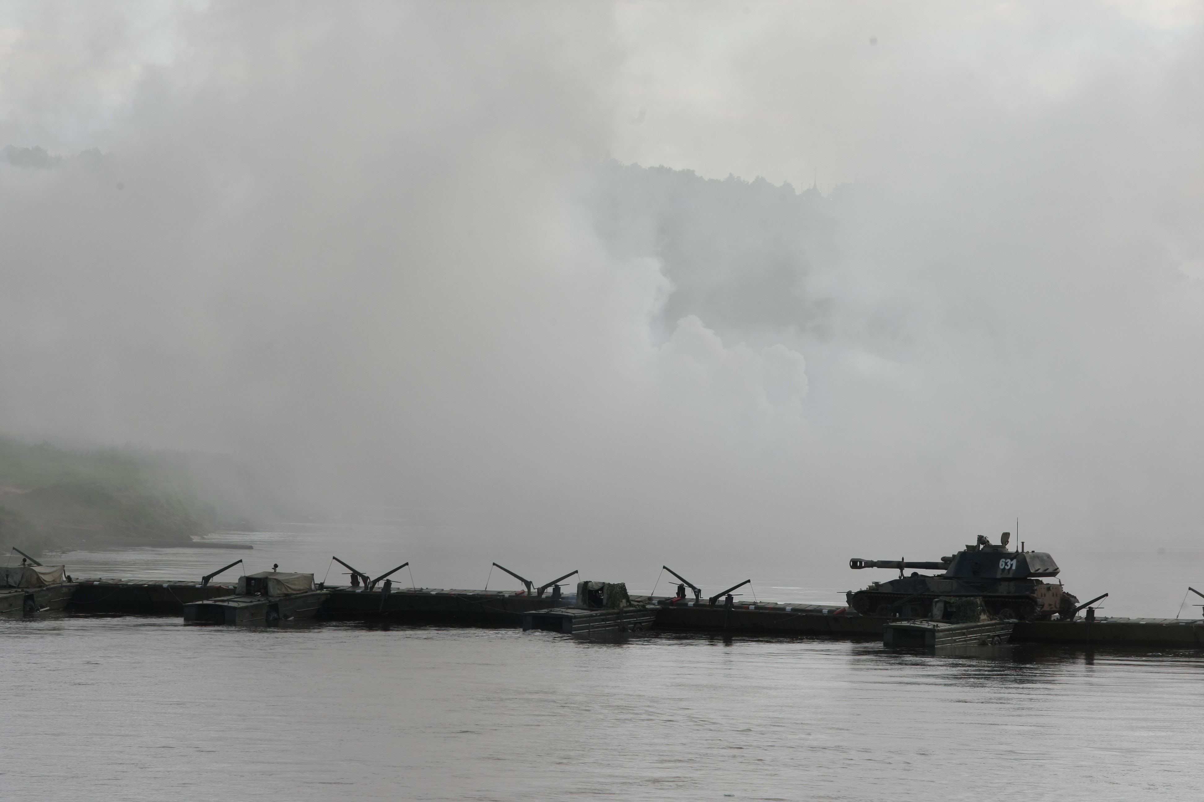 Tanks on a pontoon bridge in fog HD Wallpaper
