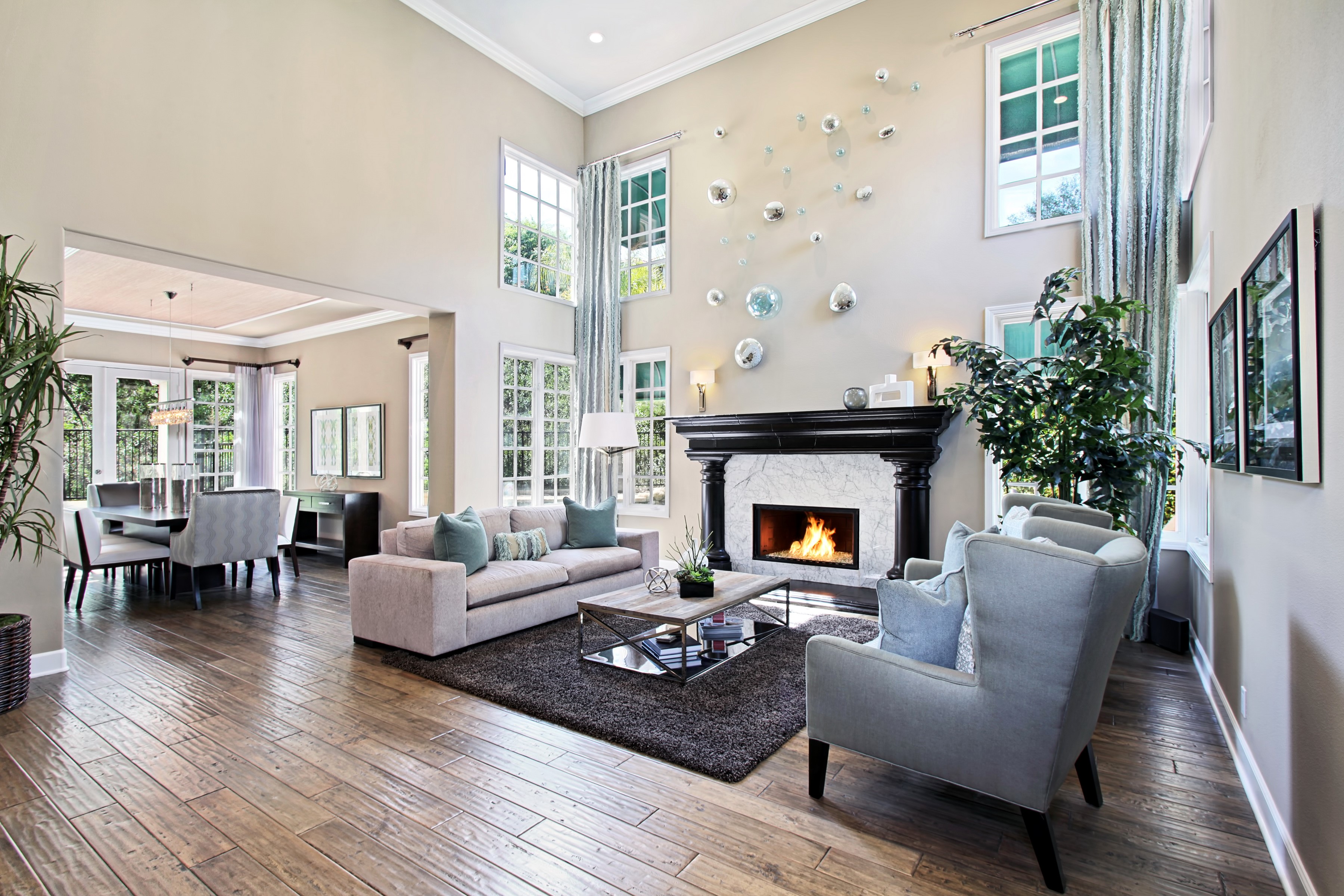 Living room with fireplace, sofa, and armchair HD Wallpaper