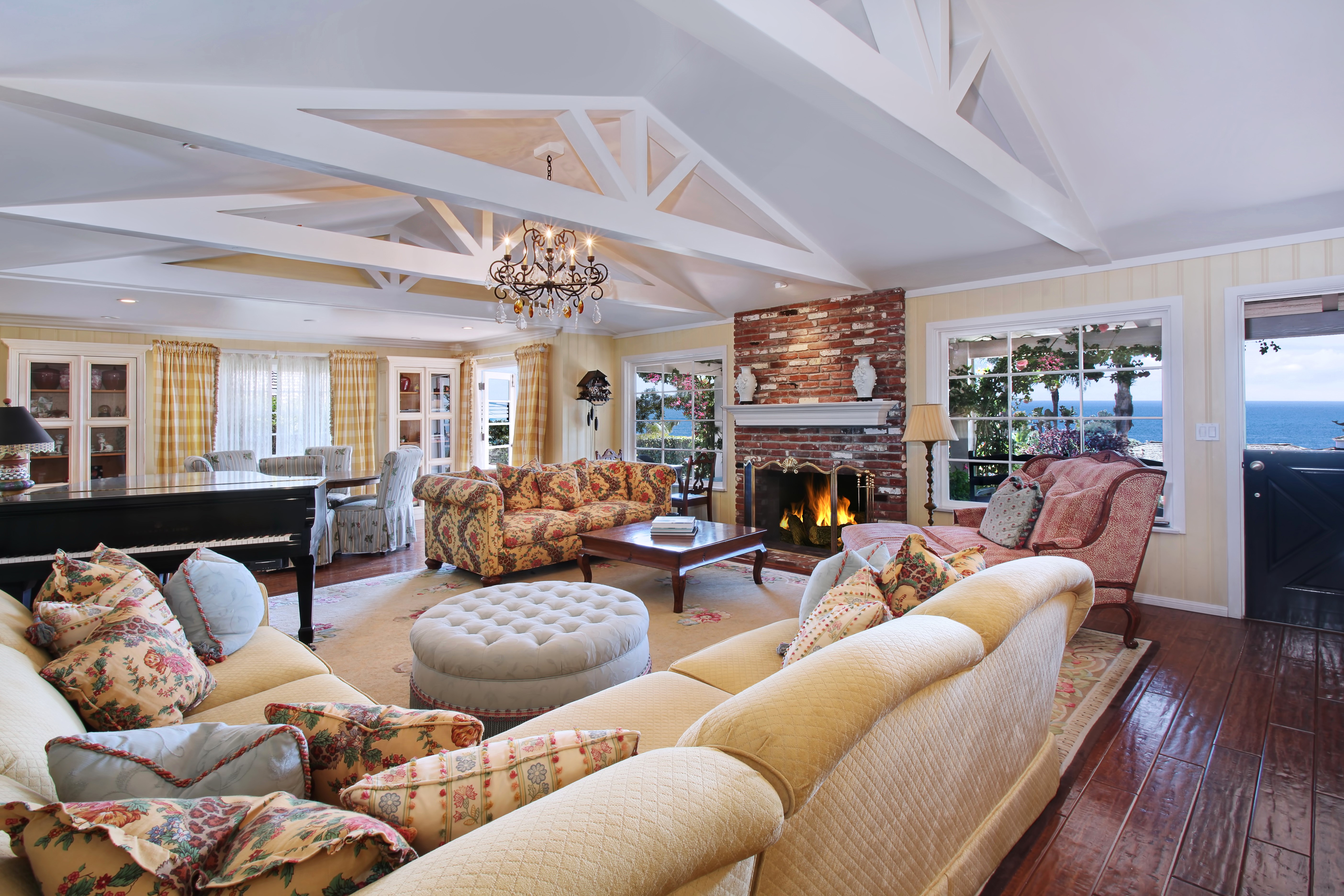 Living room with fireplace and ocean view HD Wallpaper