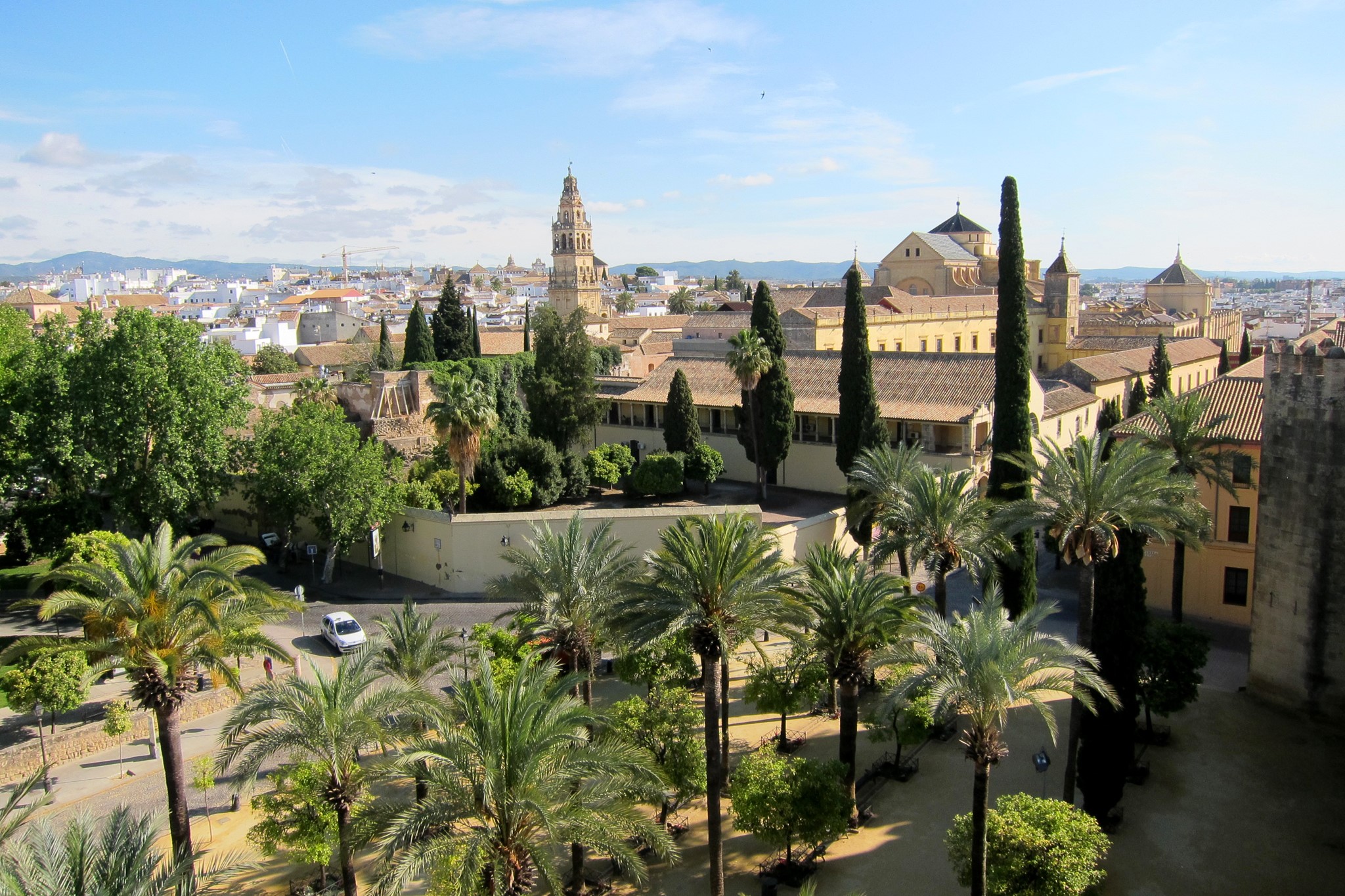 Cordoba, Spain with Mosque-Cathedral and palm trees HD Wallpaper