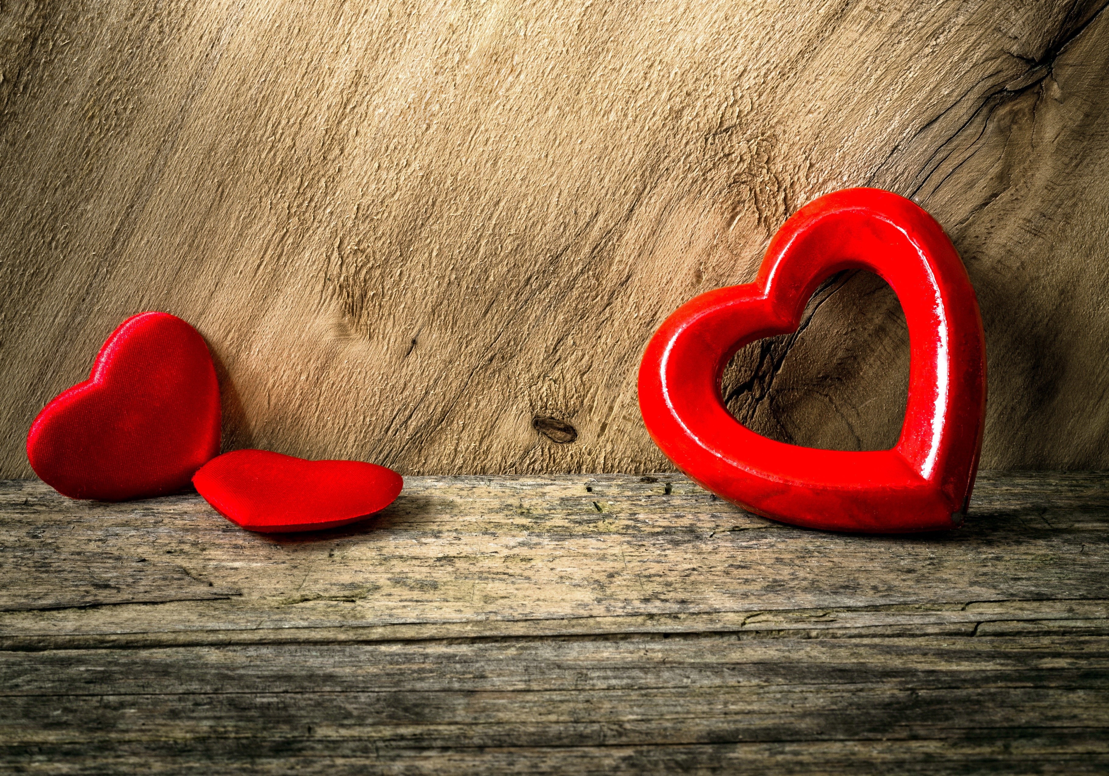 Red hearts on a wooden surface HD Wallpaper