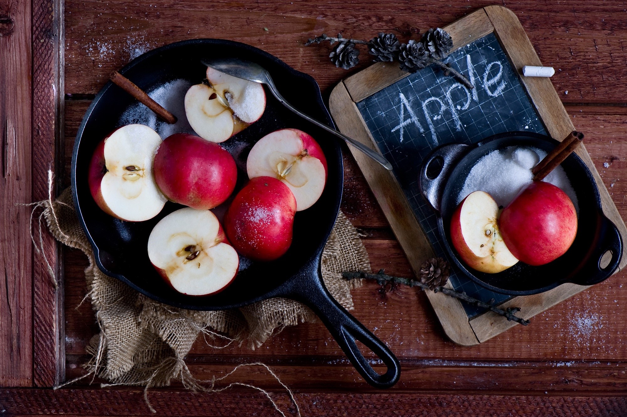 Apples in cast iron pans with sugar and cinnamon HD Wallpaper