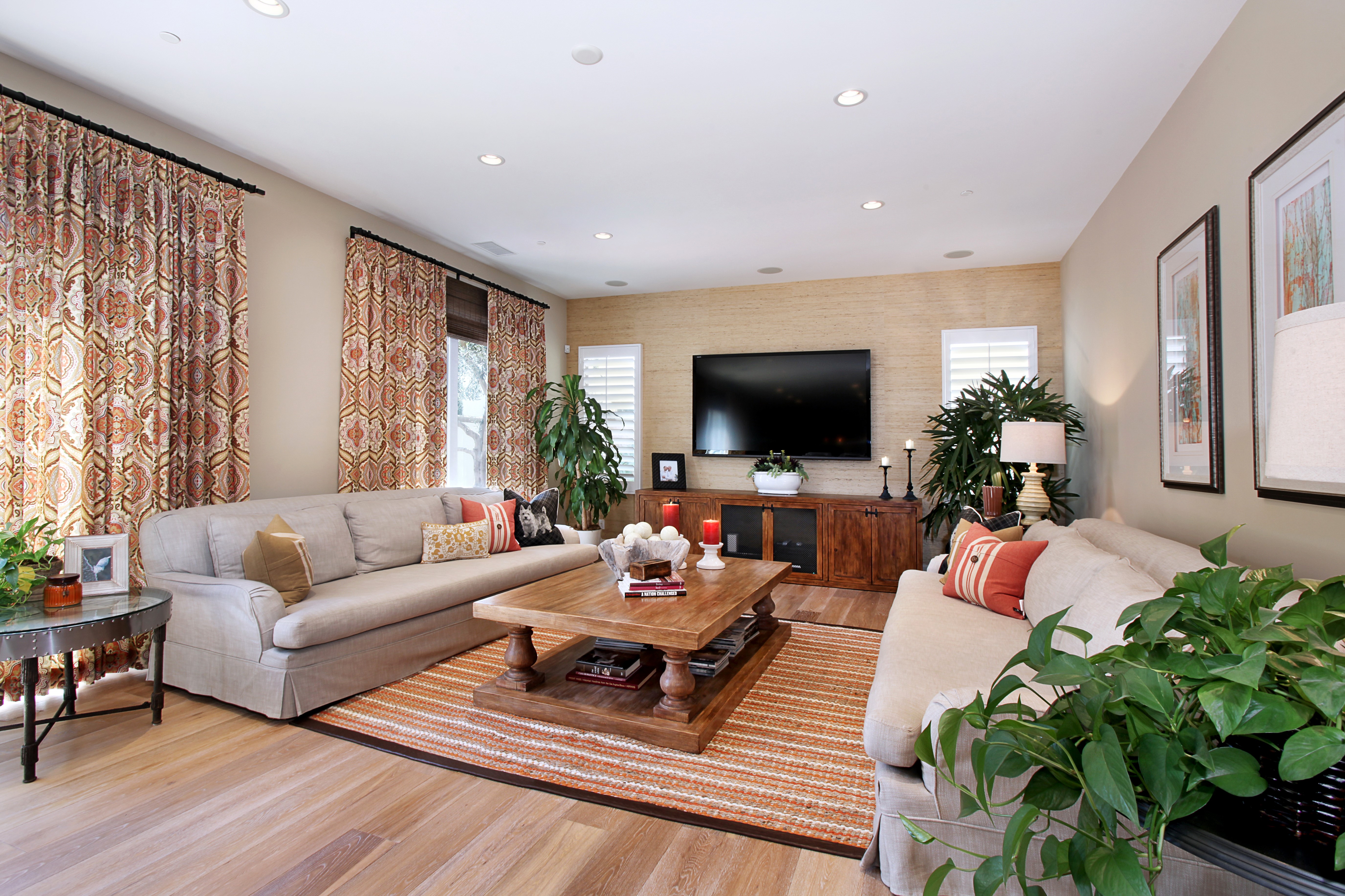 Living room with sofa, coffee table, and TV HD Wallpaper