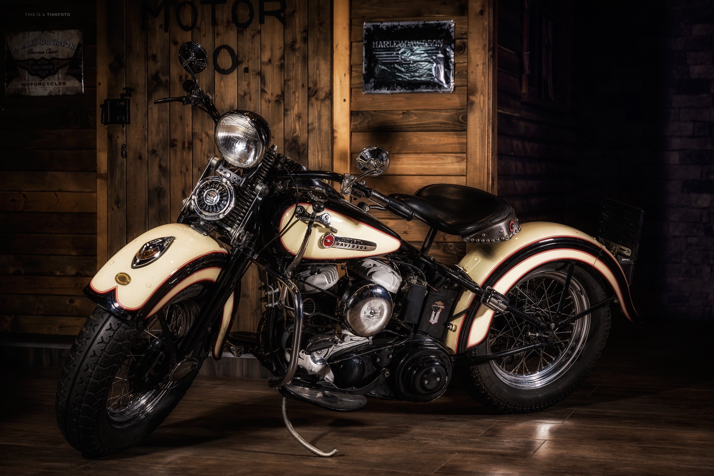 Vintage Harley-Davidson motorcycle in a wooden garage HD Wallpaper