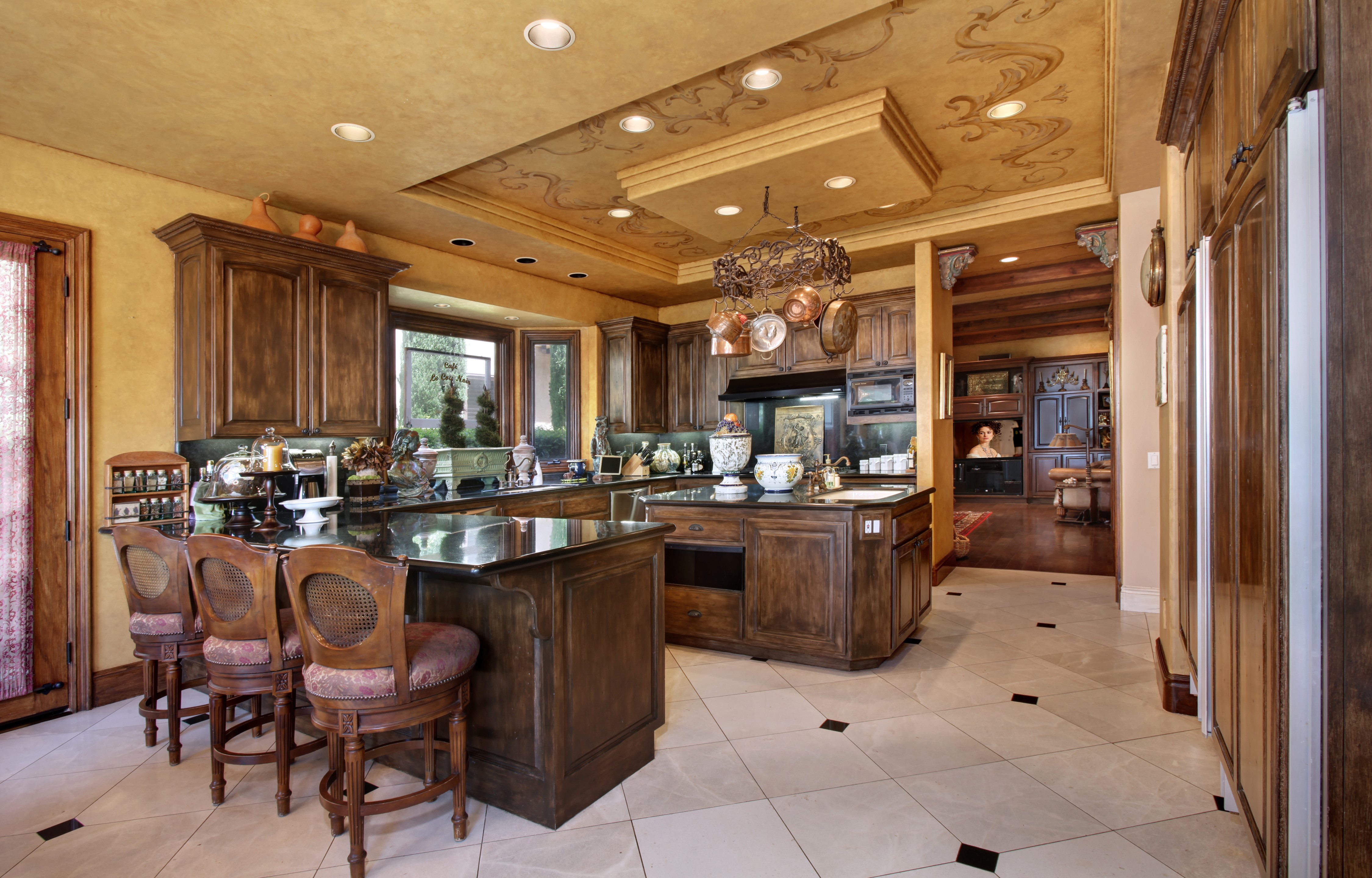Kitchen with dark wood cabinets and island HD Wallpaper