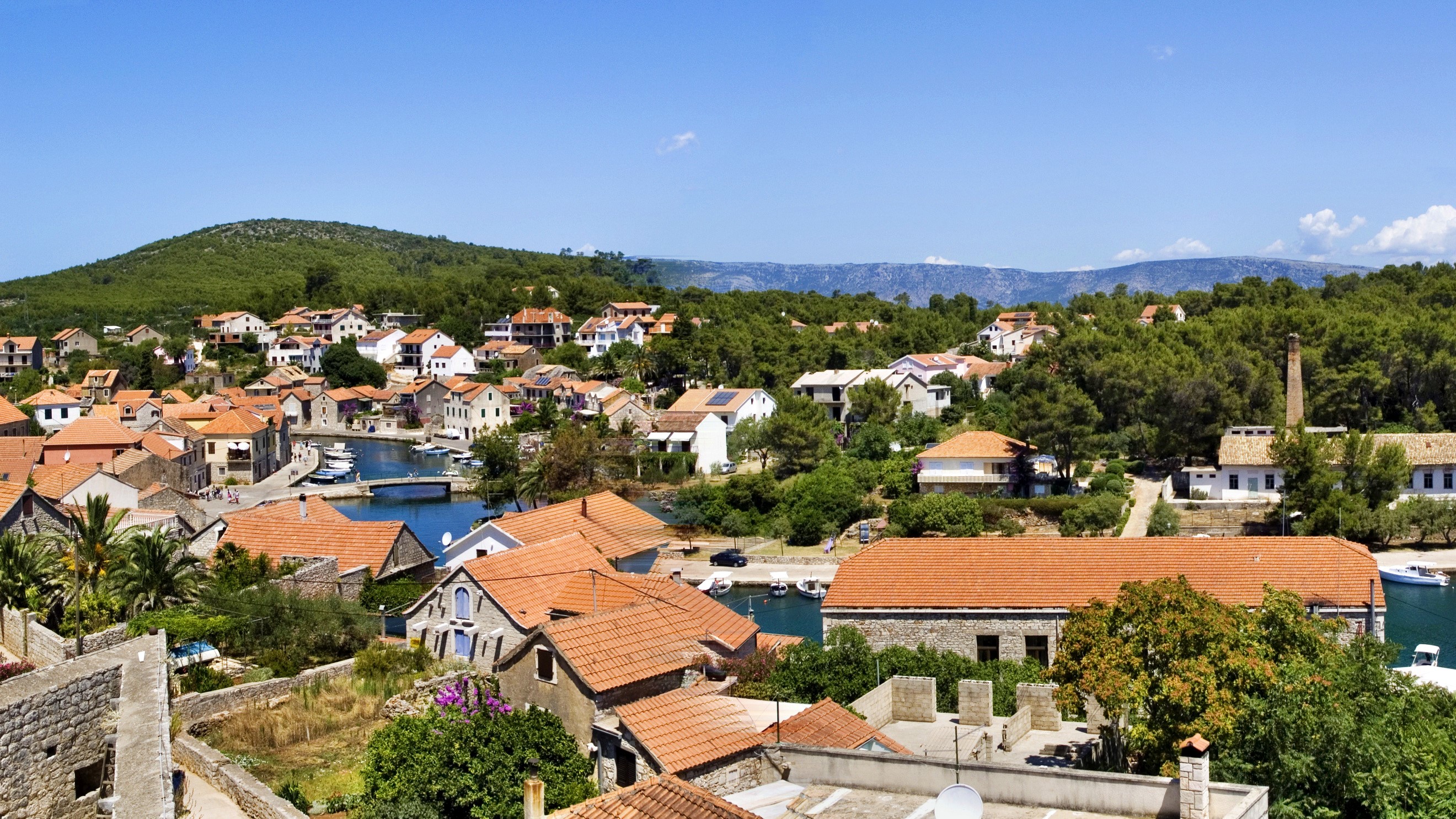 Hvar, Croatia coastal village with red-roofed houses HD Wallpaper