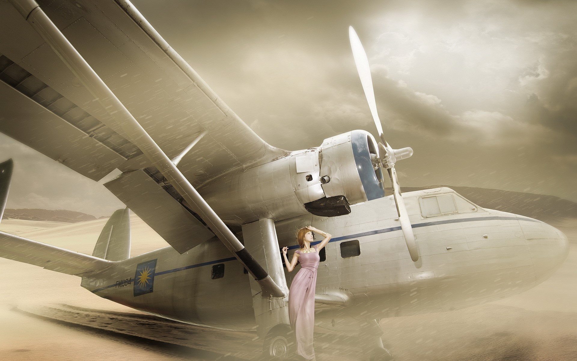Woman in a pink dress standing by an airplane HD Wallpaper