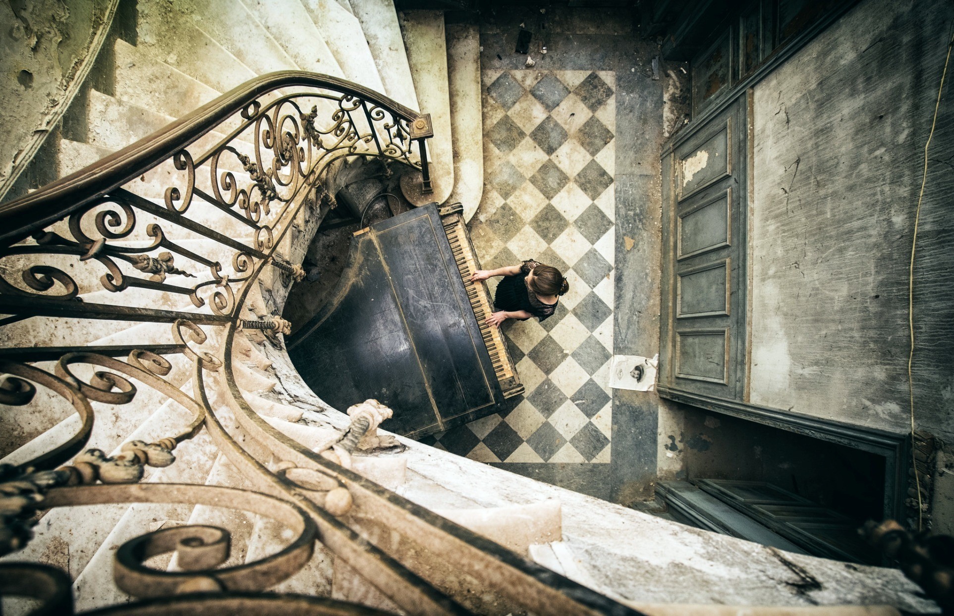 Woman playing piano on abandoned staircase HD Wallpaper