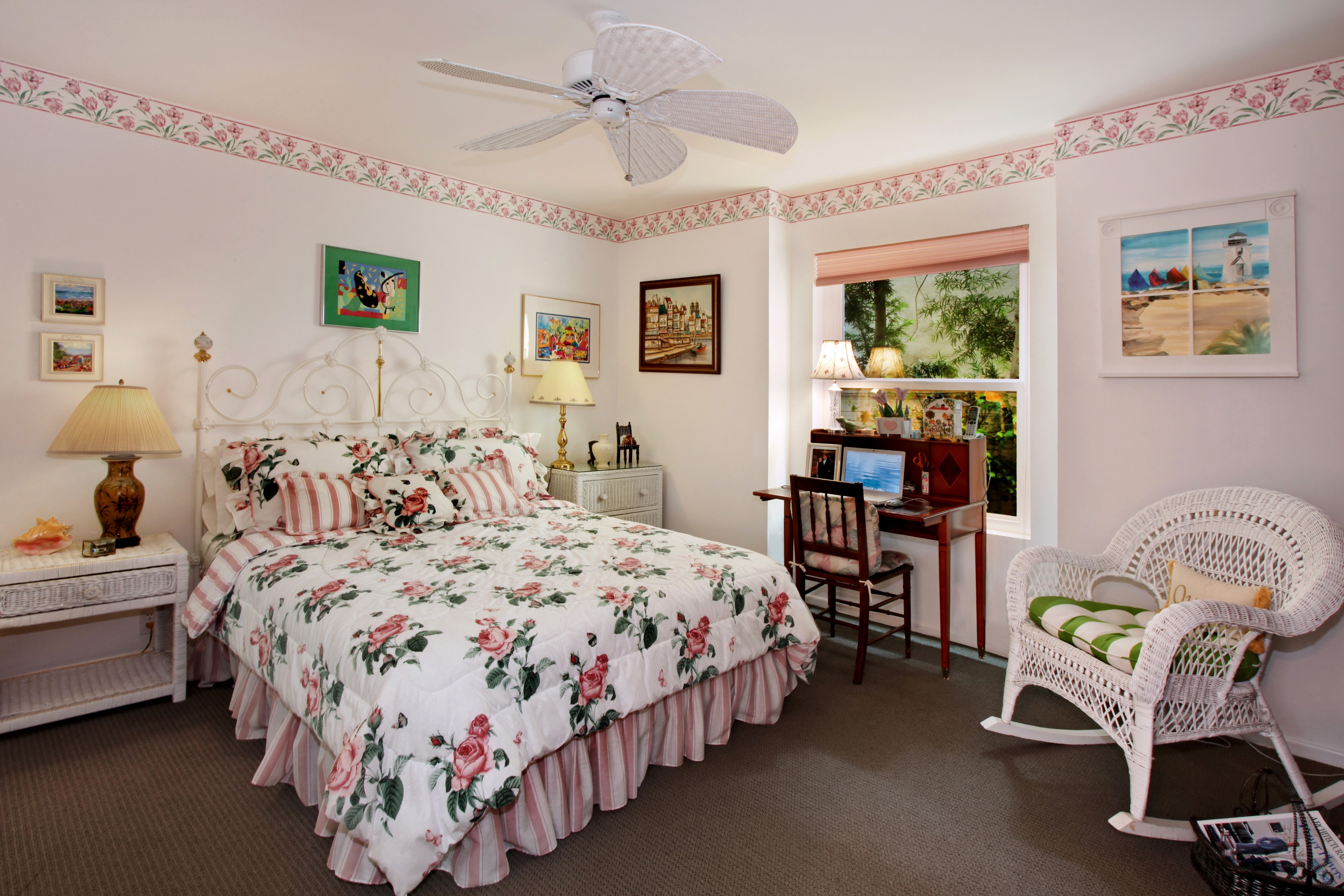 Bedroom with floral bedding and desk HD Wallpaper