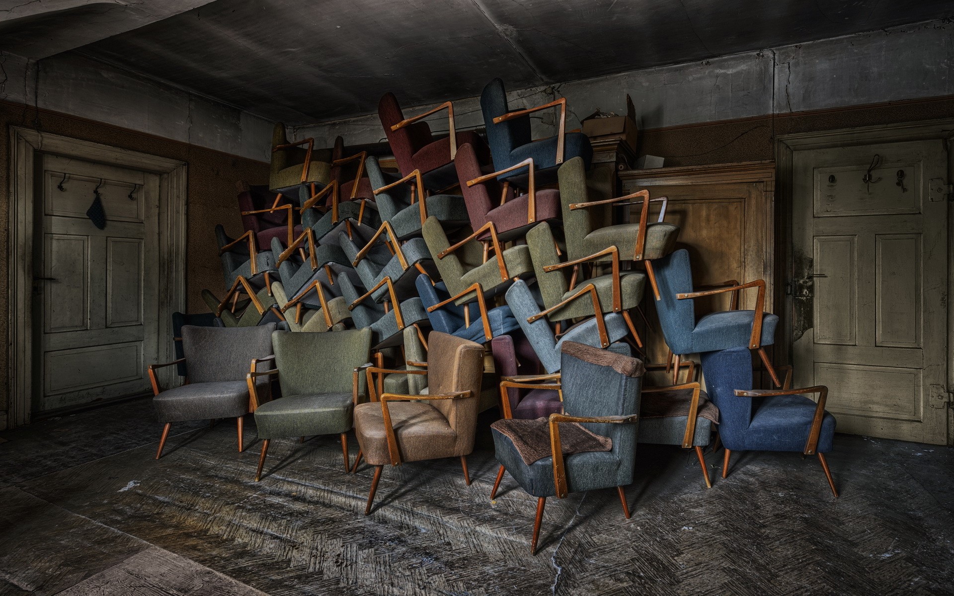 Pile of armchairs in an abandoned room HD Wallpaper