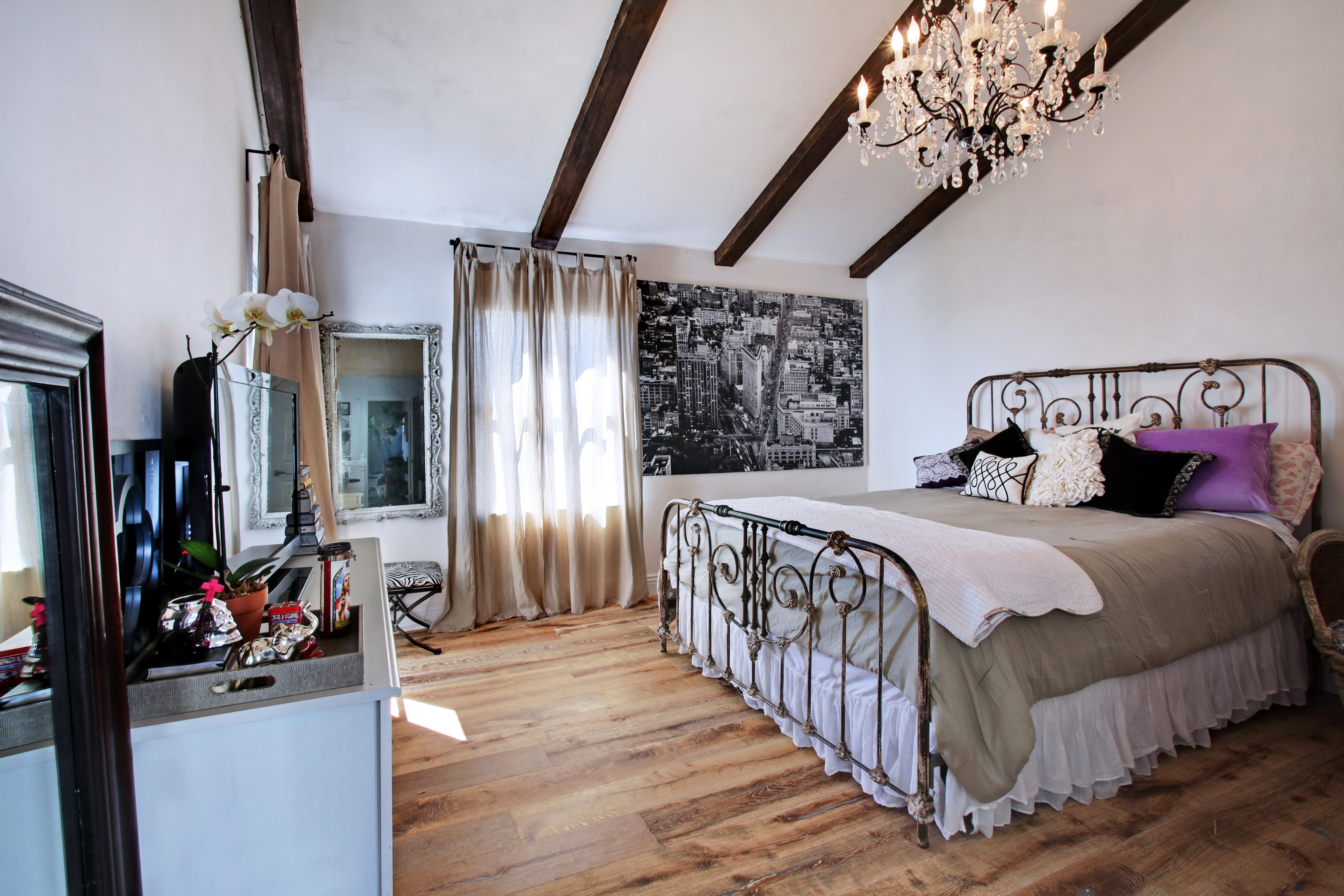 Bedroom with Chandelier and Cityscape Art HD Wallpaper