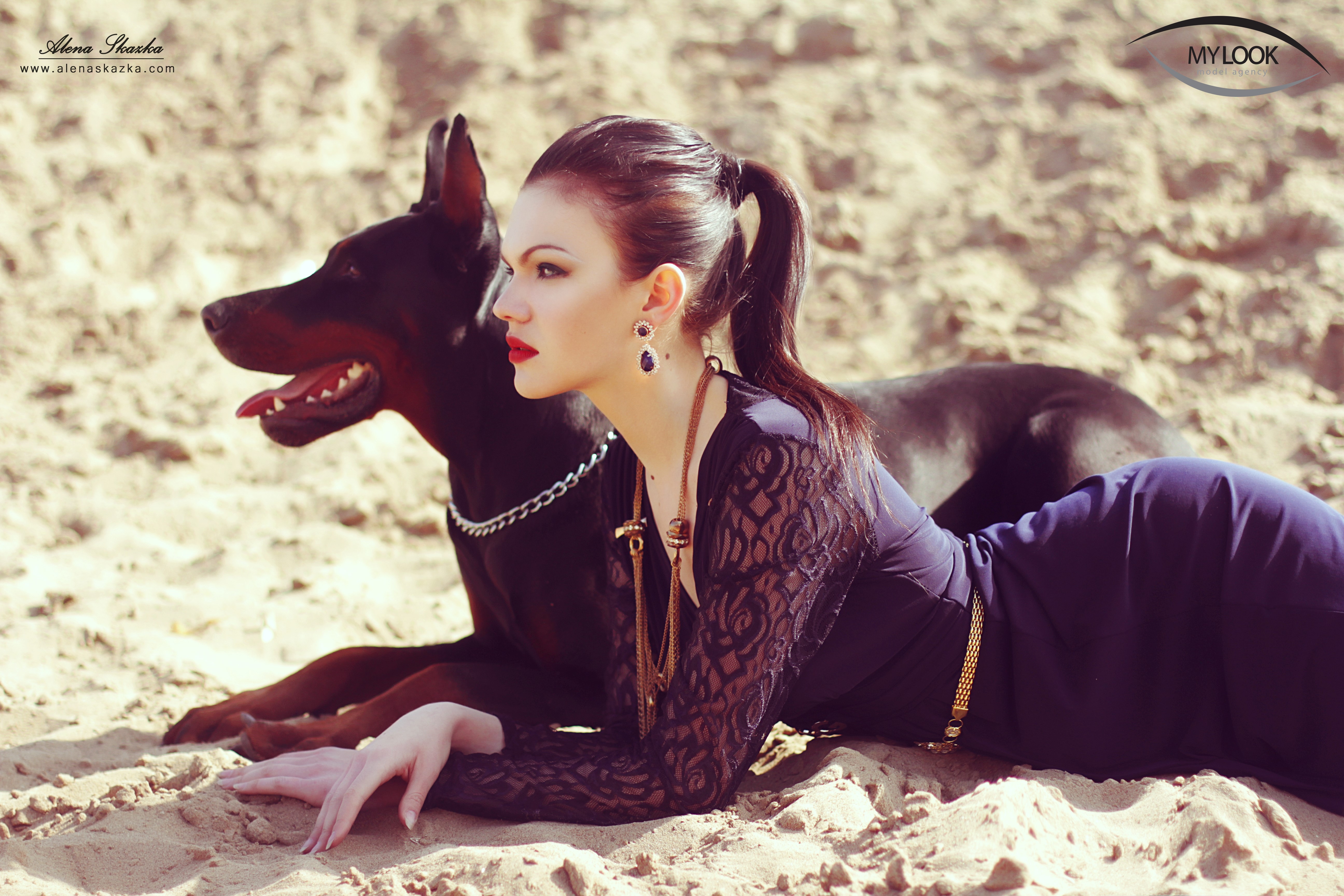 Alena Romanova with Doberman Pinscher on Sand HD Wallpaper