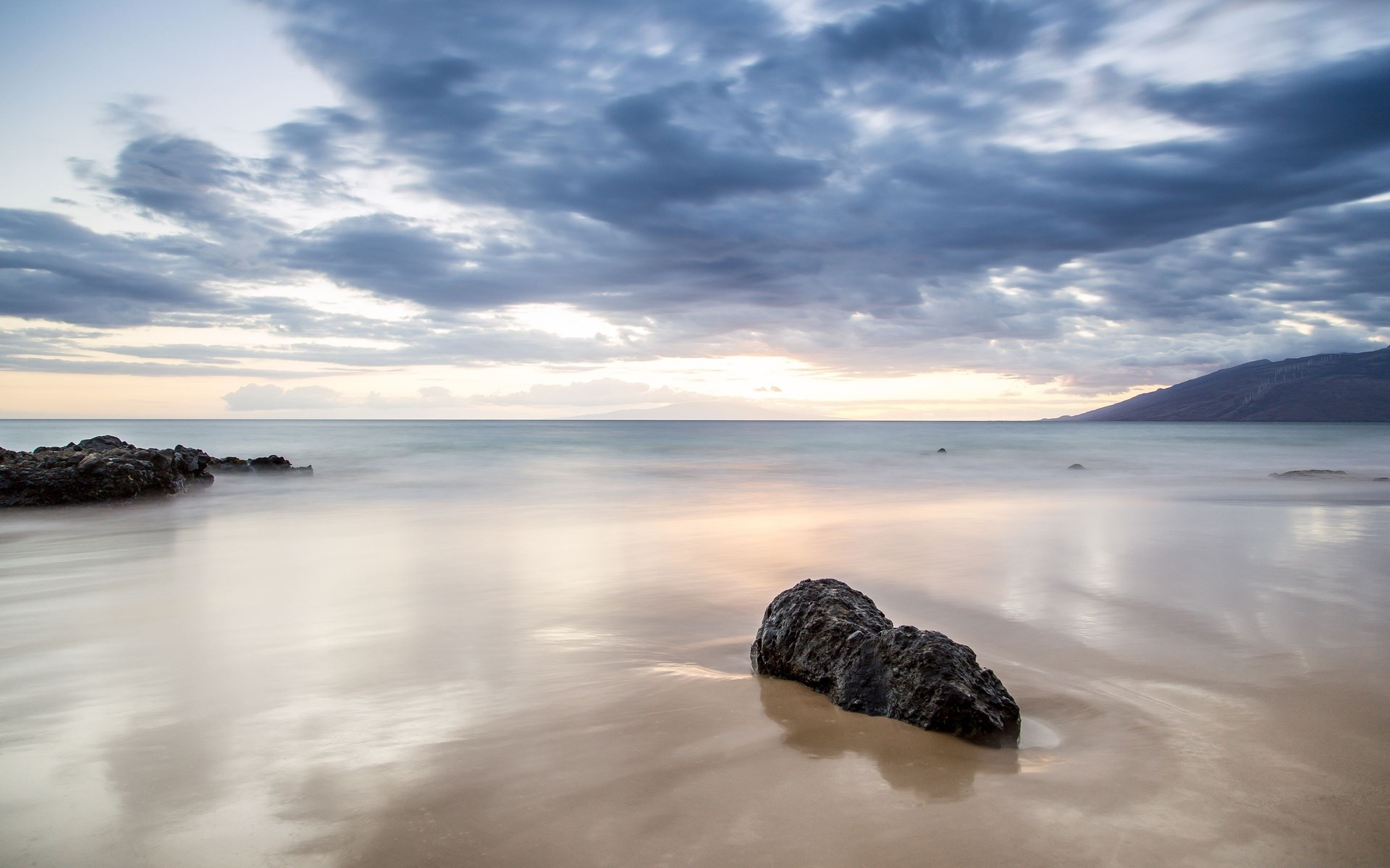 Long exposure of a rocky beach at sunset HD Wallpaper