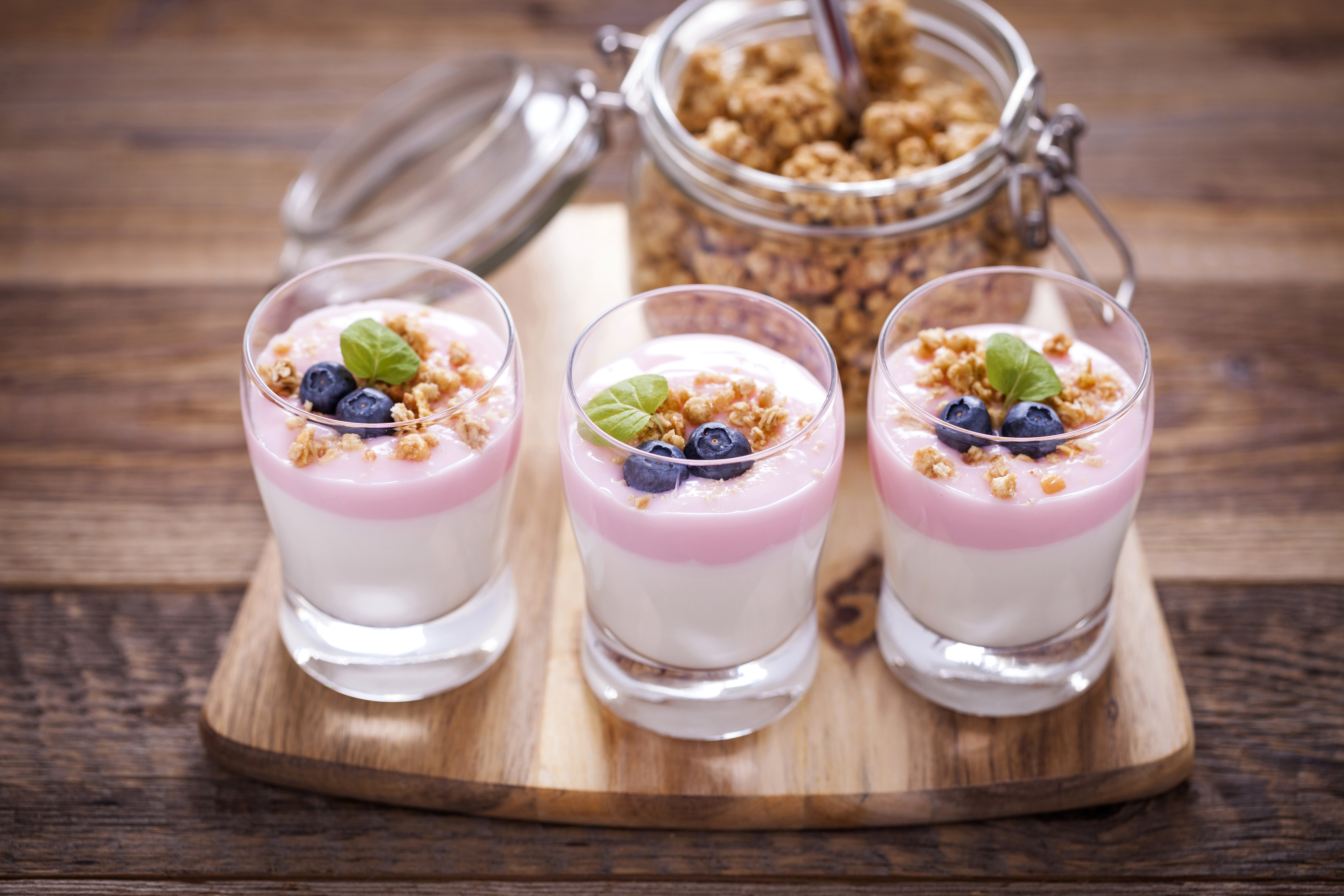 Three glasses of yogurt with blueberries and granola HD Wallpaper