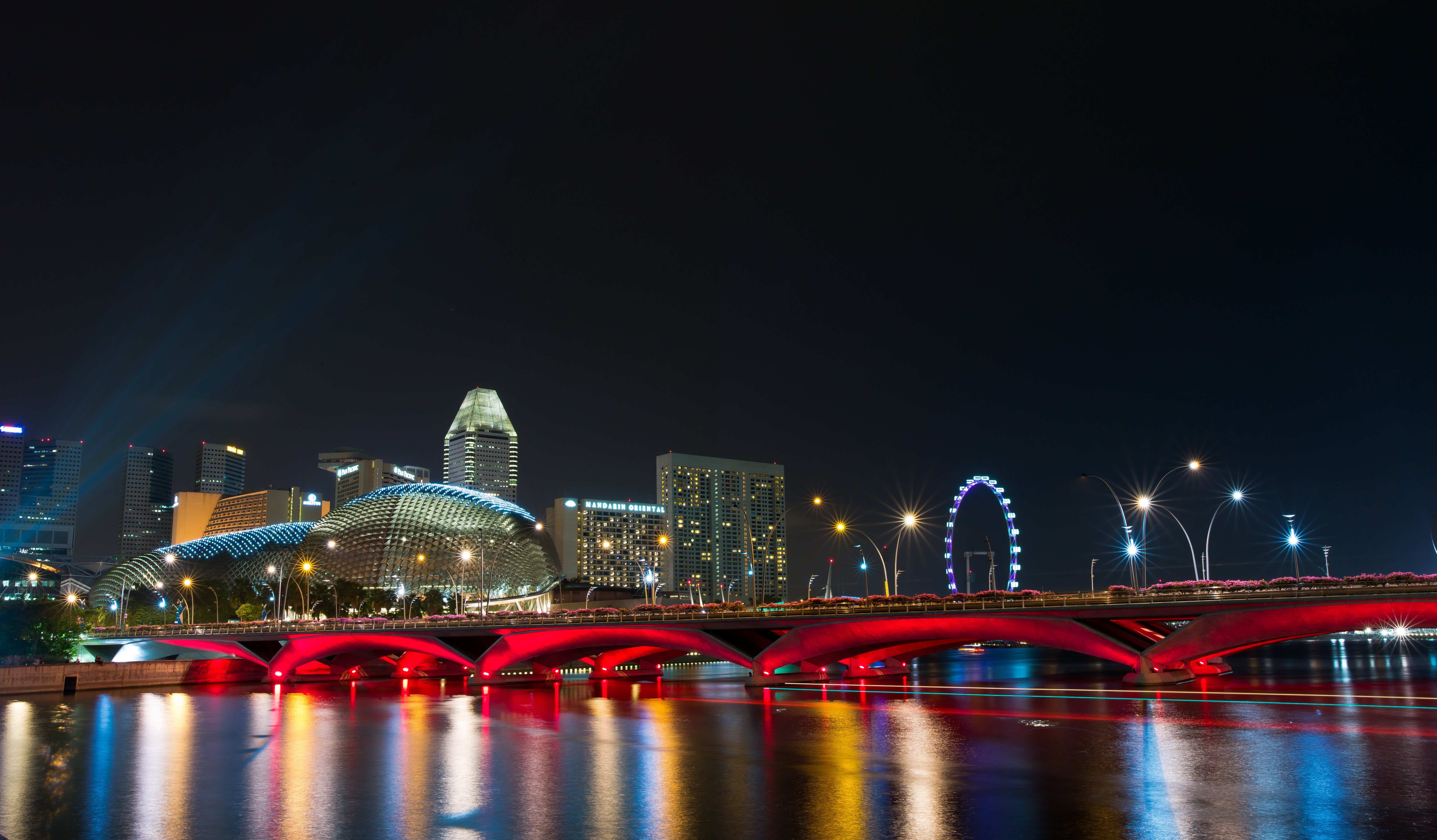 Singapore skyline with illuminated bridge at night HD Wallpaper
