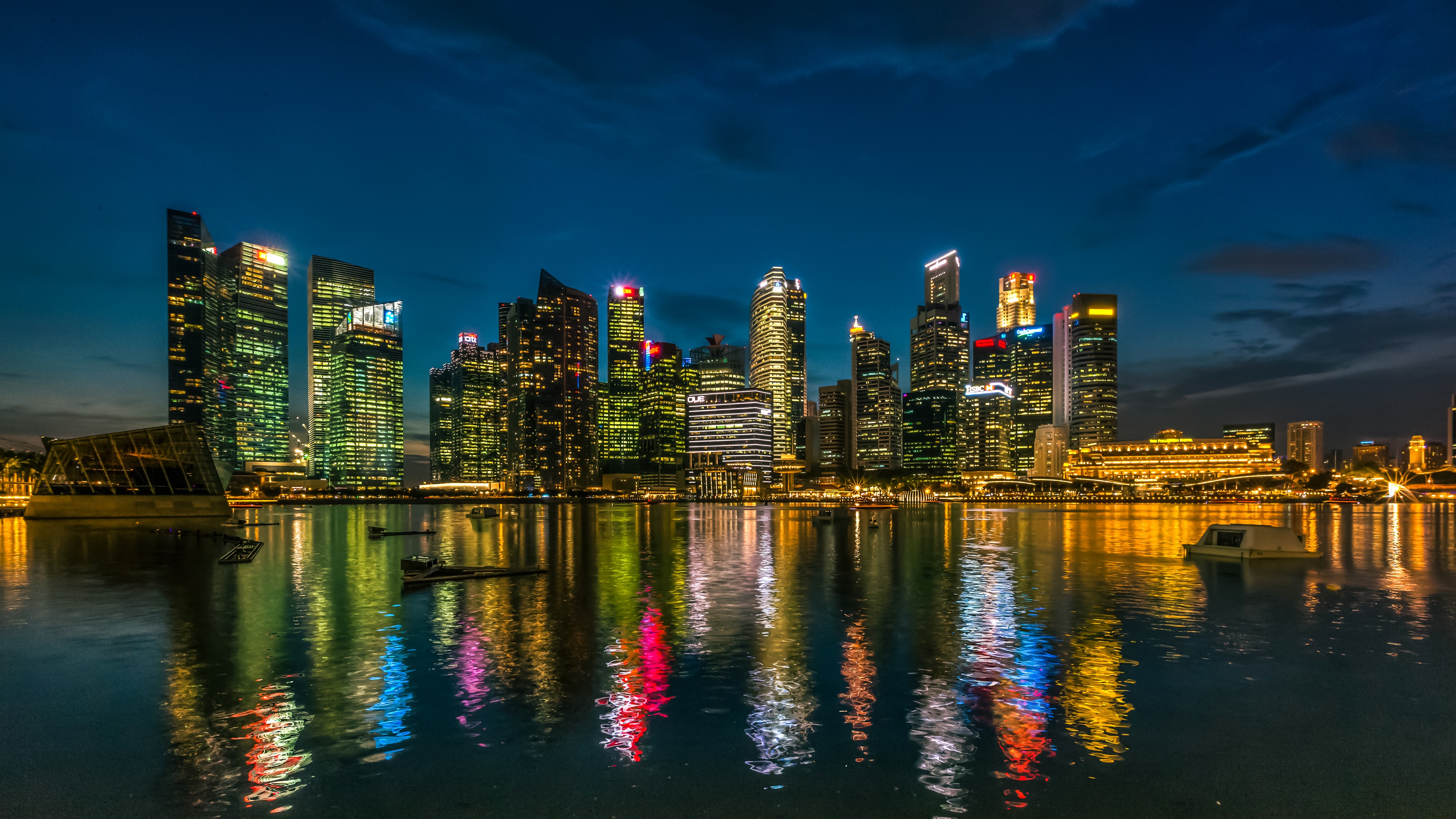 Singapore skyline with skyscrapers and river at night HD Wallpaper