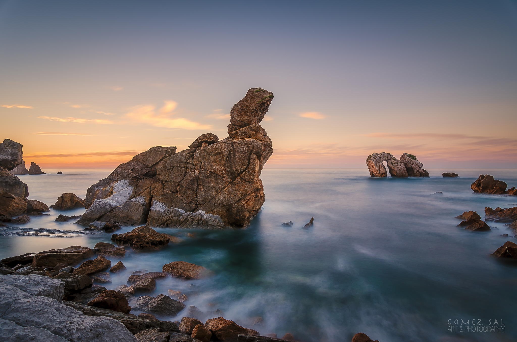 Rocky coast with sea arch at sunset HD Wallpaper