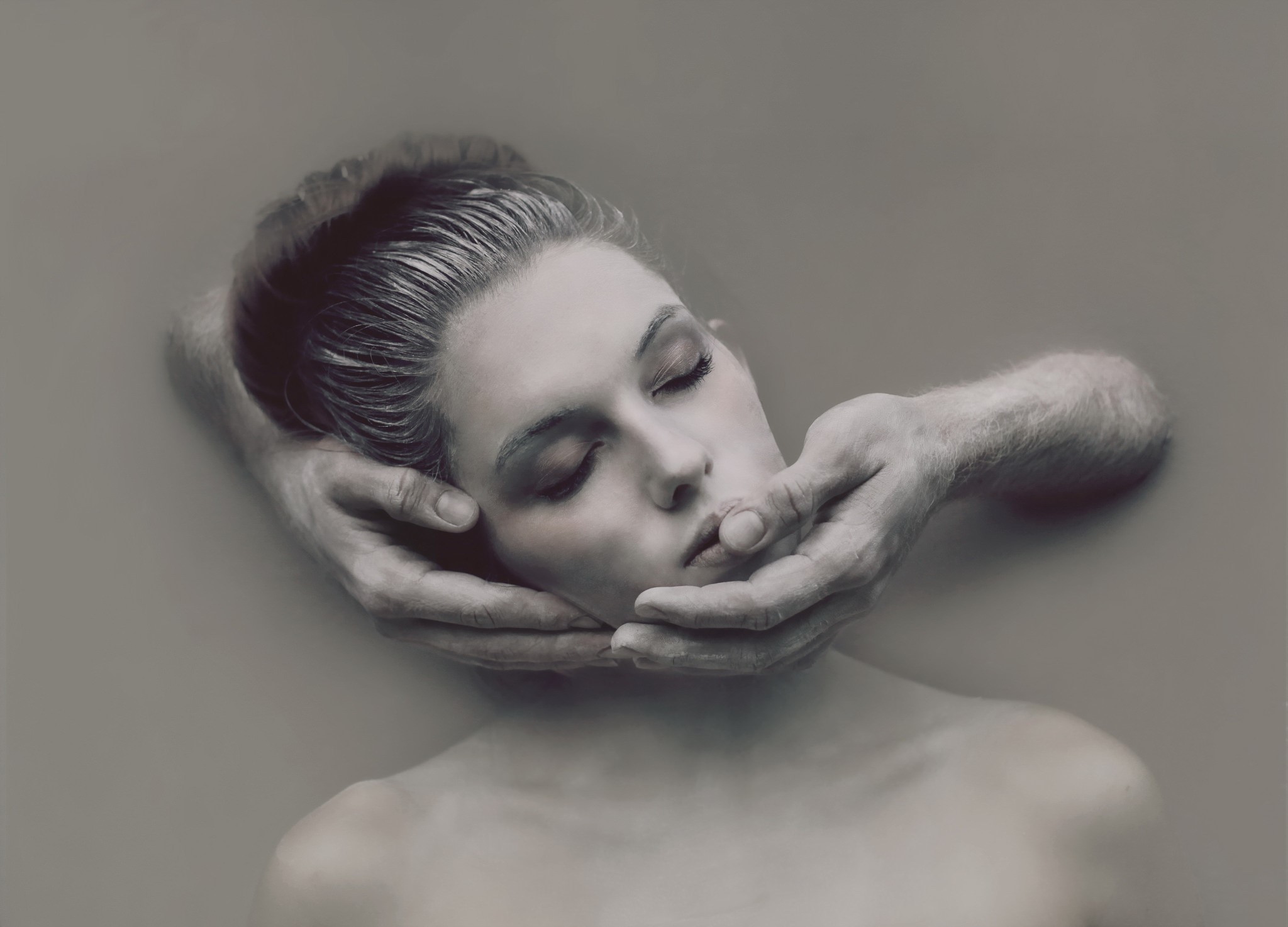 Woman's face held by hands HD Wallpaper