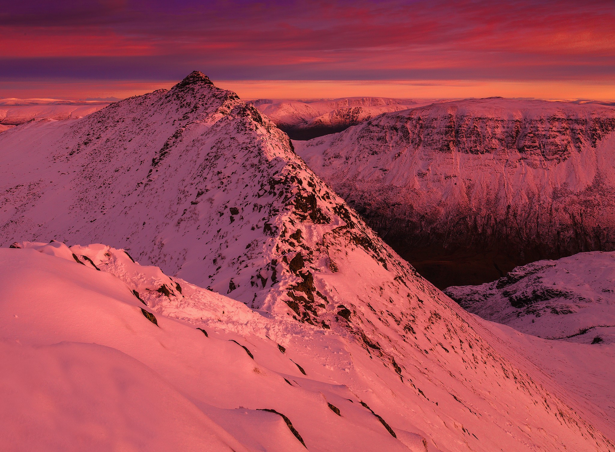 Snow-covered mountains at sunset with pink sky HD Wallpaper