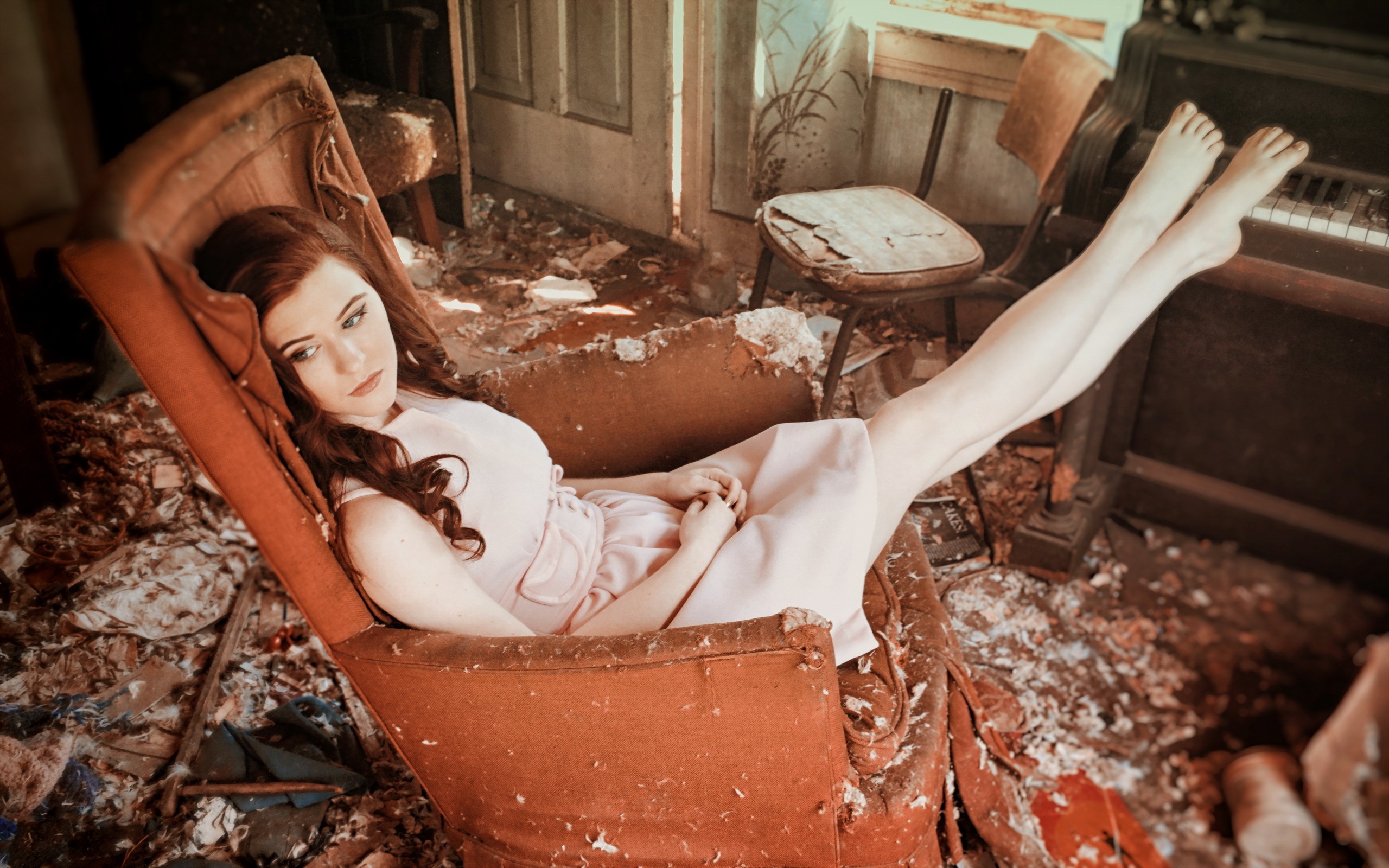 Woman with brown hair in an armchair in a derelict room HD Wallpaper
