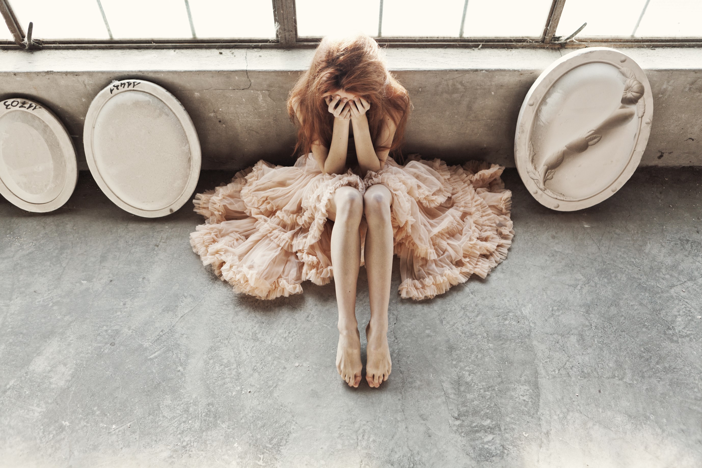 Woman in ruffled dress covering face HD Wallpaper