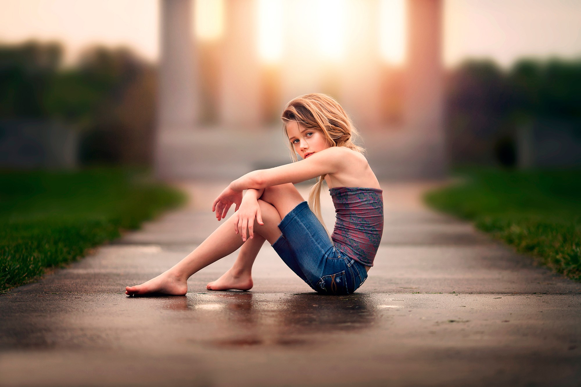 Blonde Girl Sitting on Asphalt Road at Sunset HD Wallpaper
