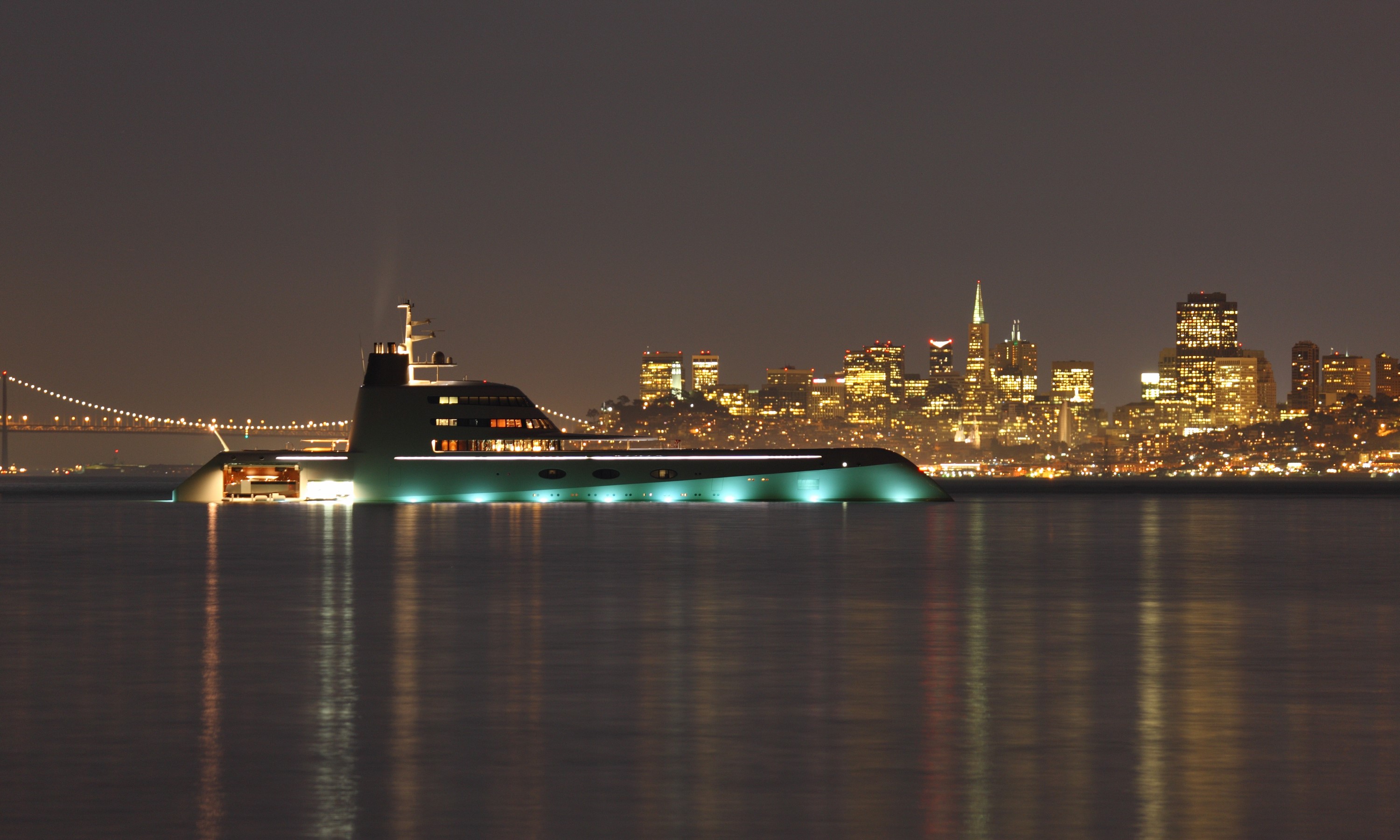 Luxury yacht at night with San Francisco skyline HD Wallpaper