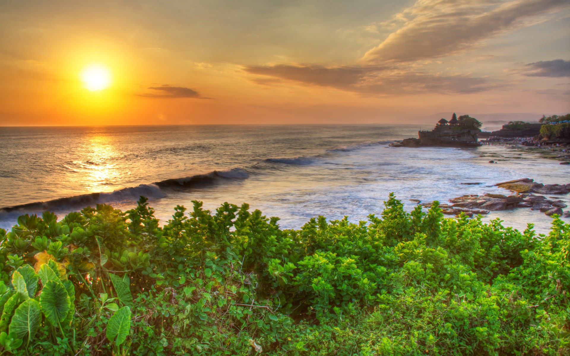 Sunset over the ocean with a temple on a rock HD Wallpaper