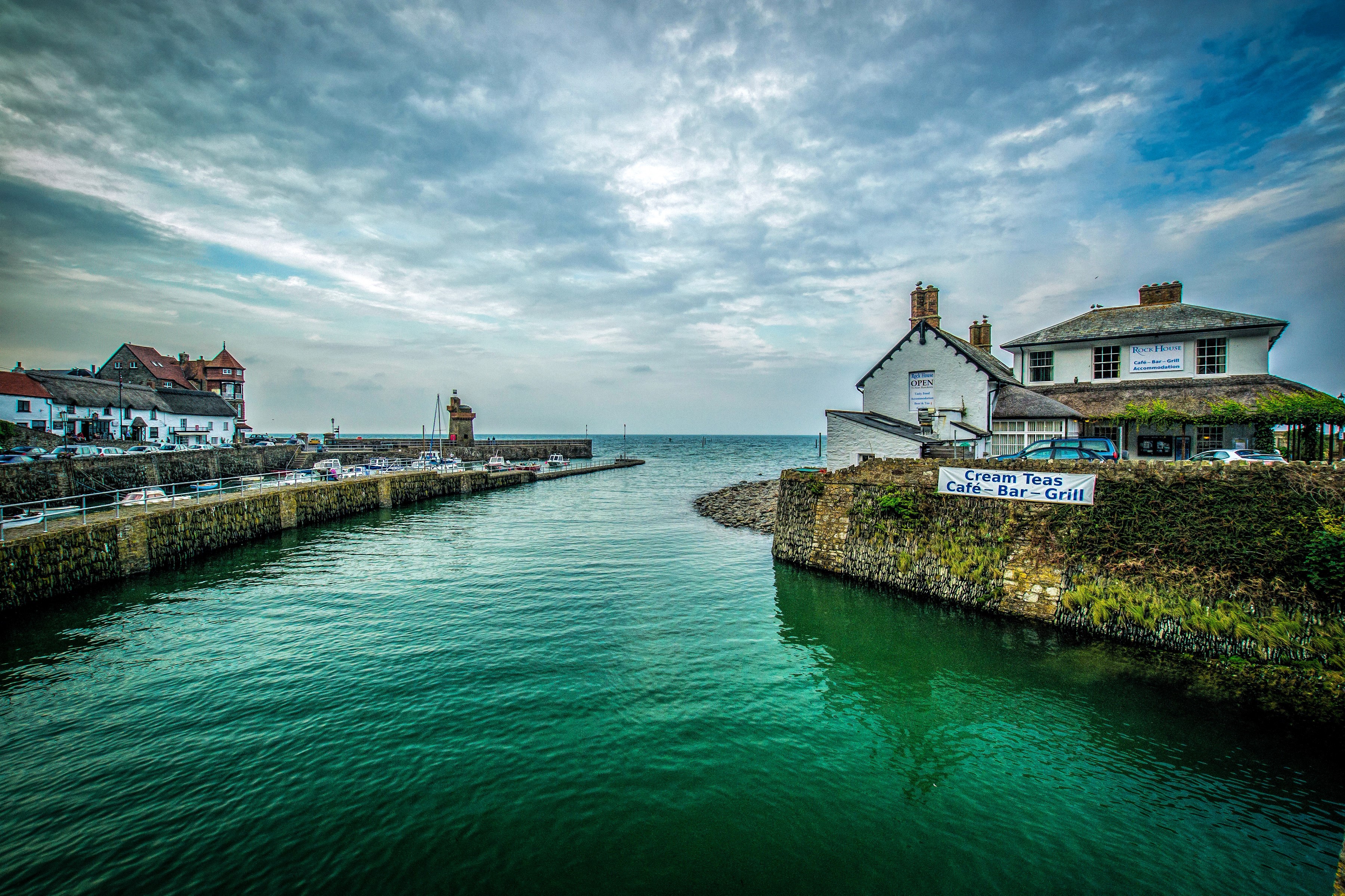 Lynmouth Harbour with Lighthouse and Buildings HD Wallpaper