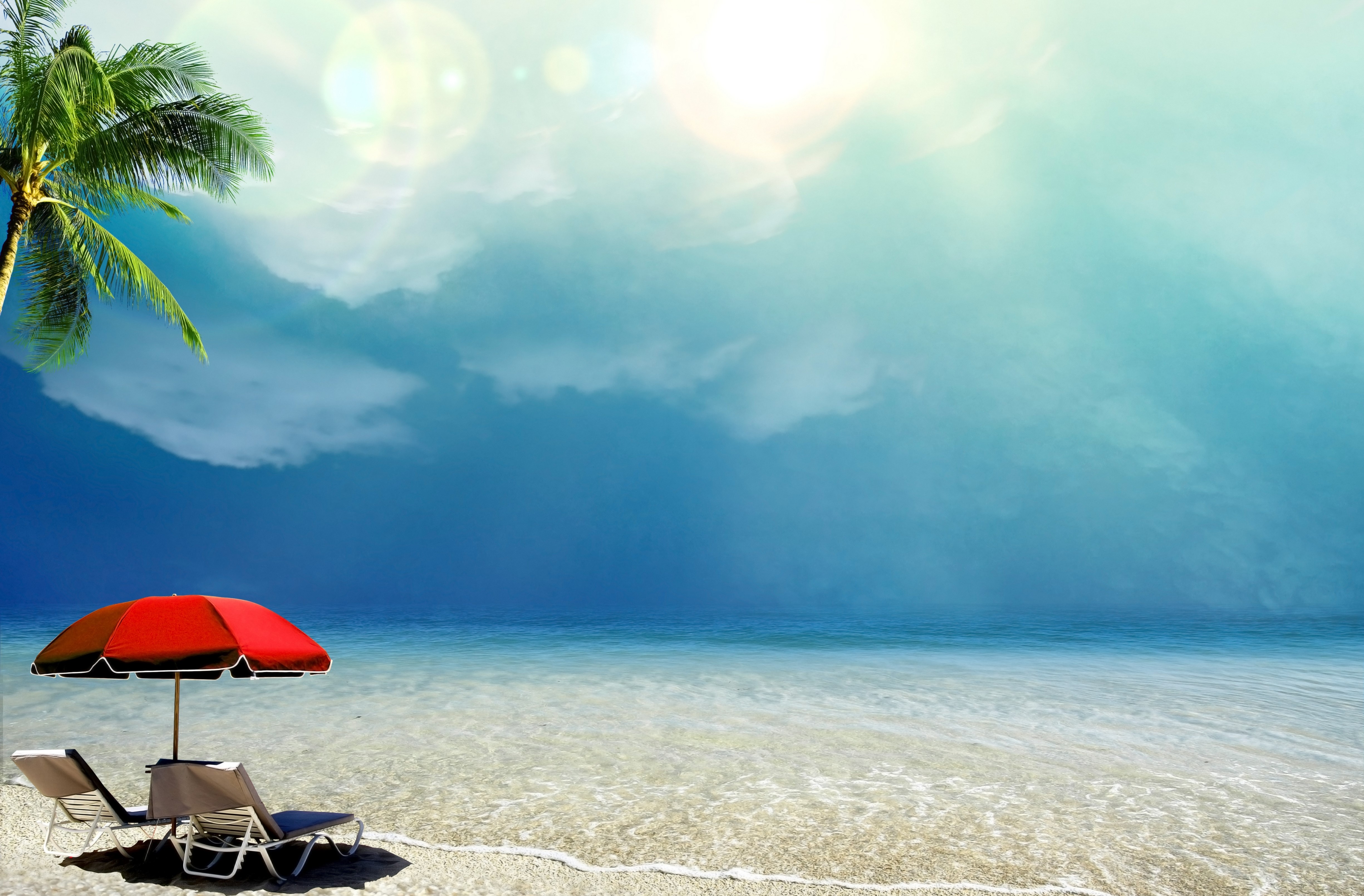 Beach with umbrella and lounge chairs HD Wallpaper