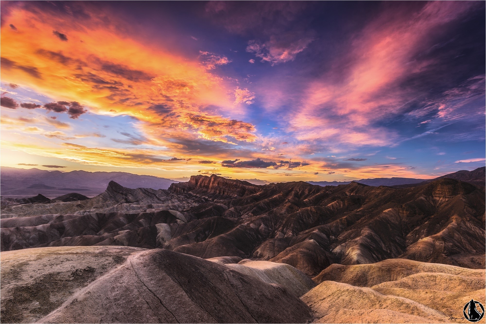 Desert mountains at sunset with colorful clouds HD Wallpaper