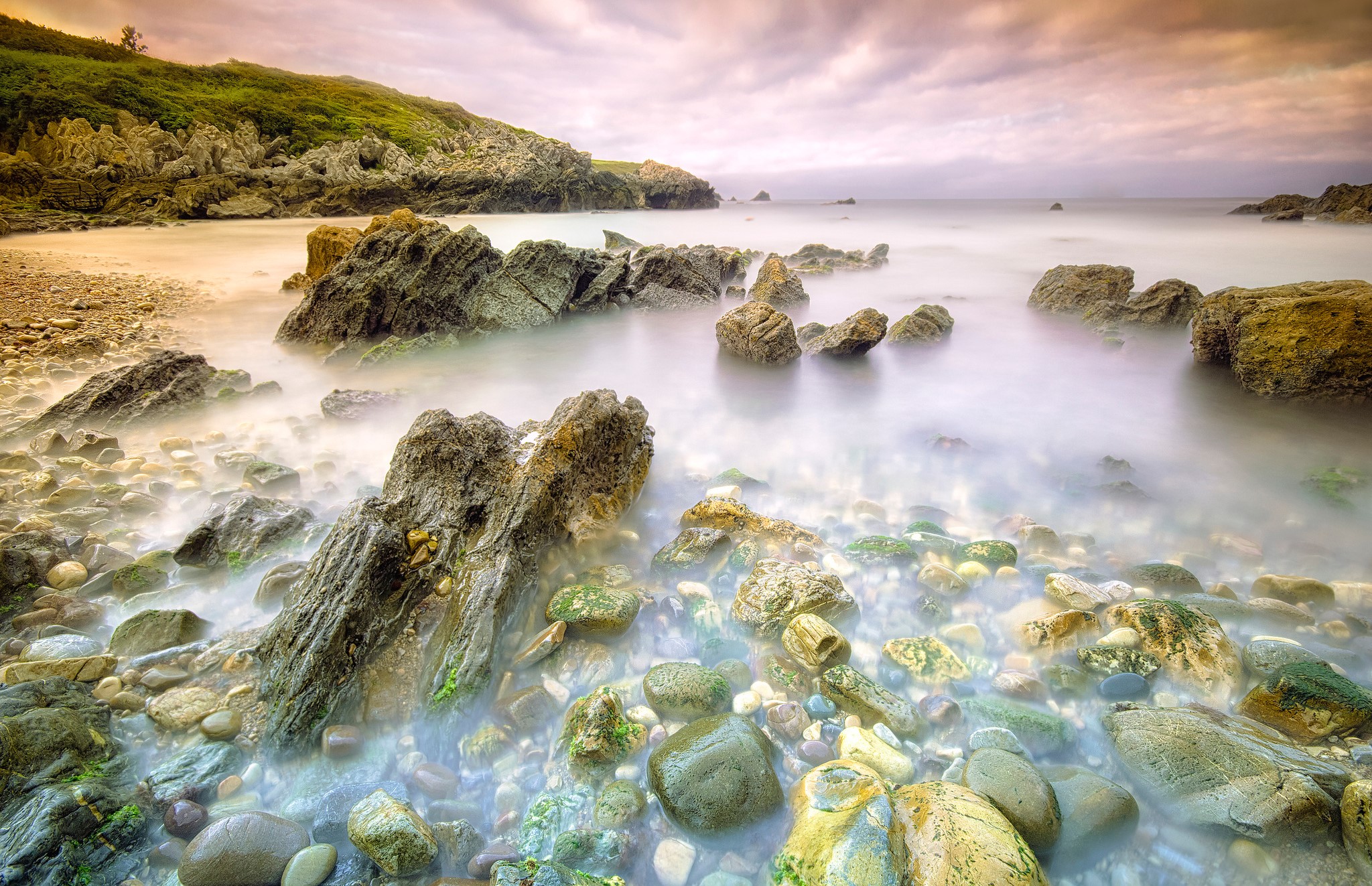 Rocky Coastline with Misty Sea and Green Hill HD Wallpaper