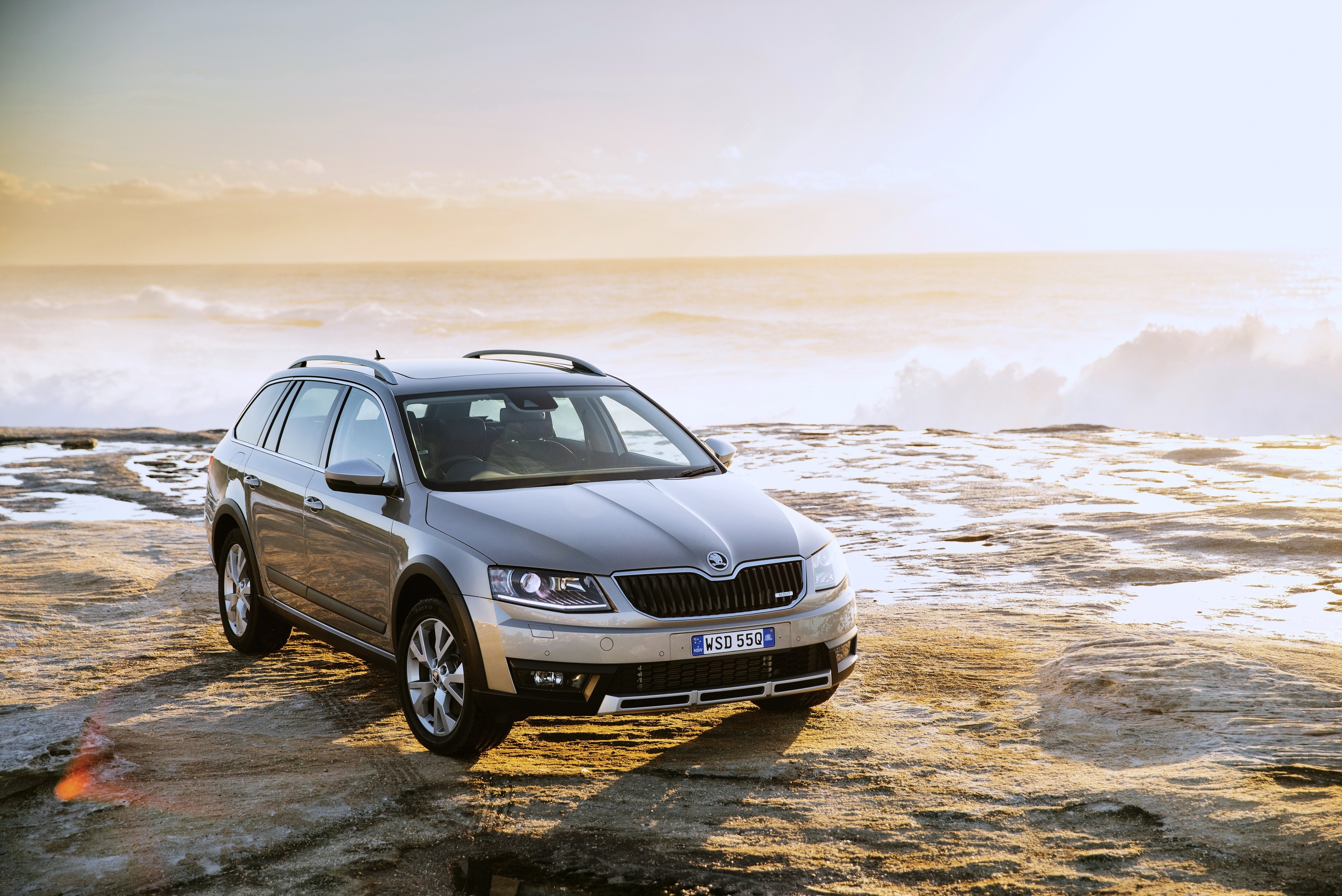 Skoda Octavia Scout AU-spec car on rocky shore HD Wallpaper