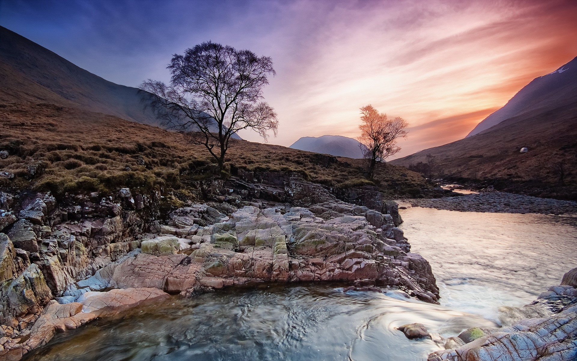 River flowing through a valley at sunset in Scotland HD Wallpaper