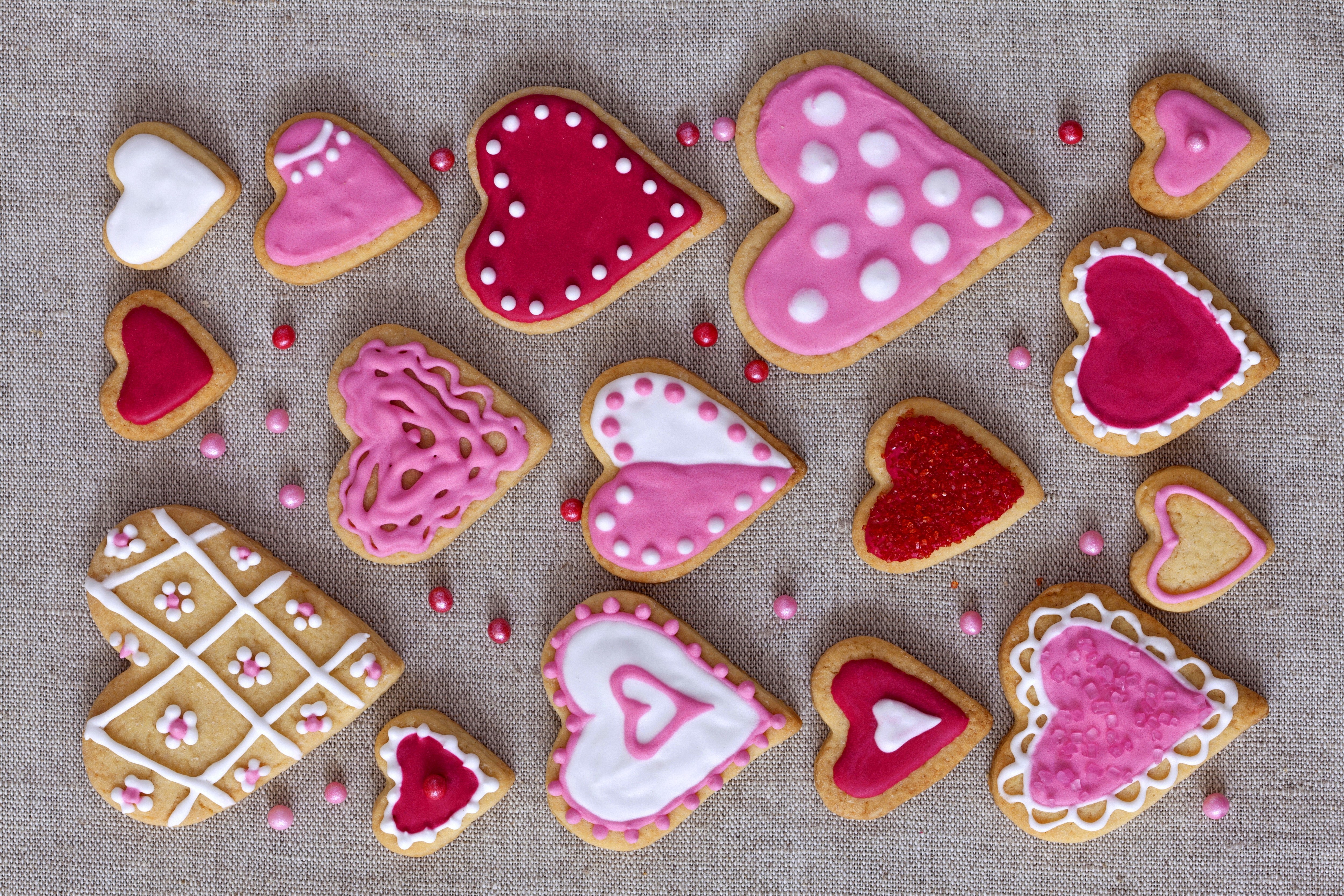 Heart-shaped cookies with colorful icing and sprinkles HD Wallpaper