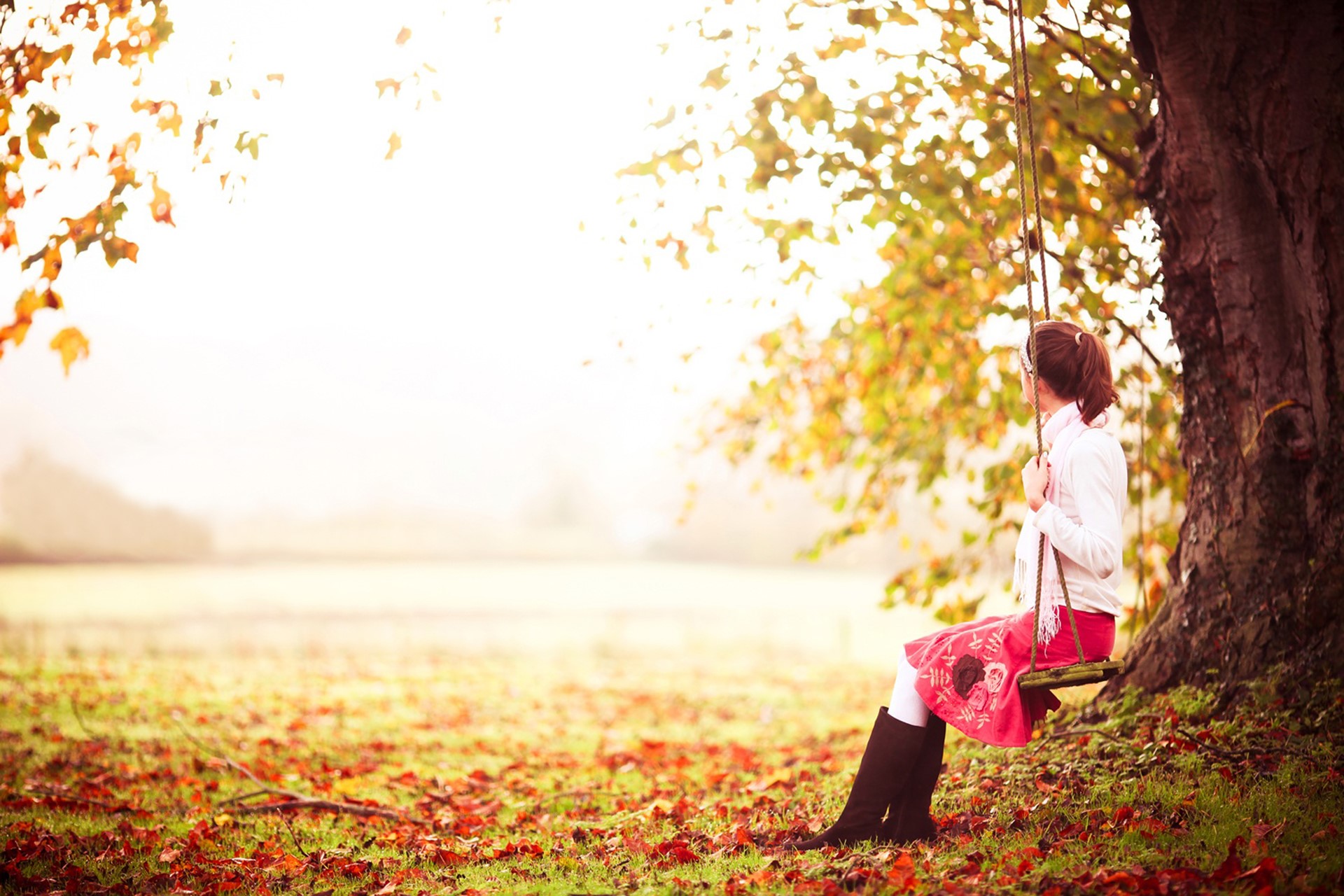 Girl on a swing in autumn park HD Wallpaper