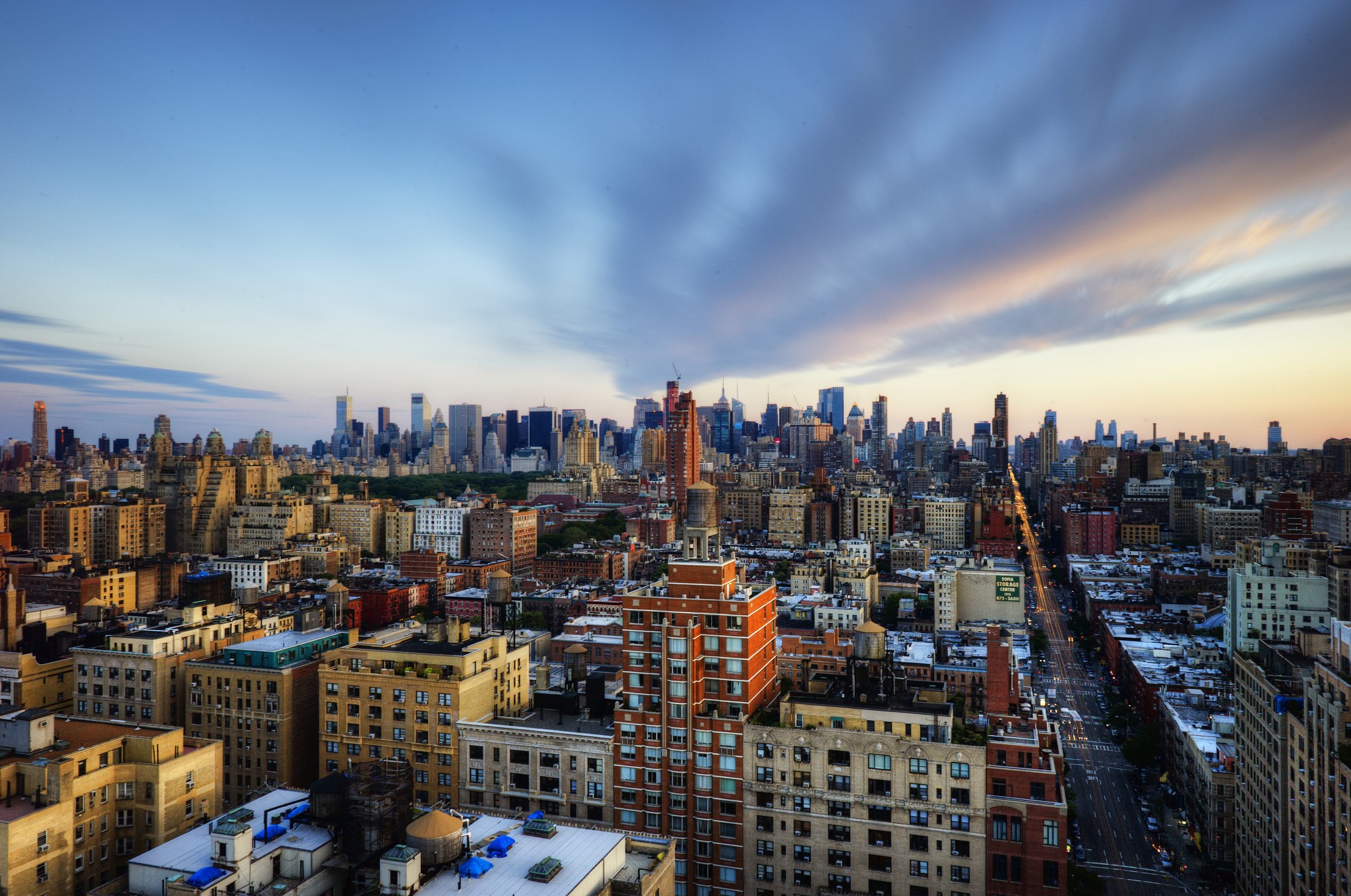 New York City skyline at dusk with clouds HD Wallpaper