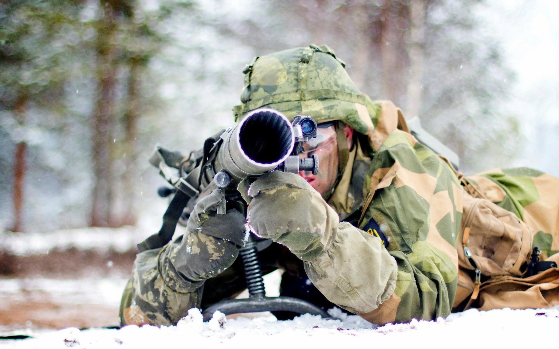 Soldier aiming a weapon in the snow HD Wallpaper