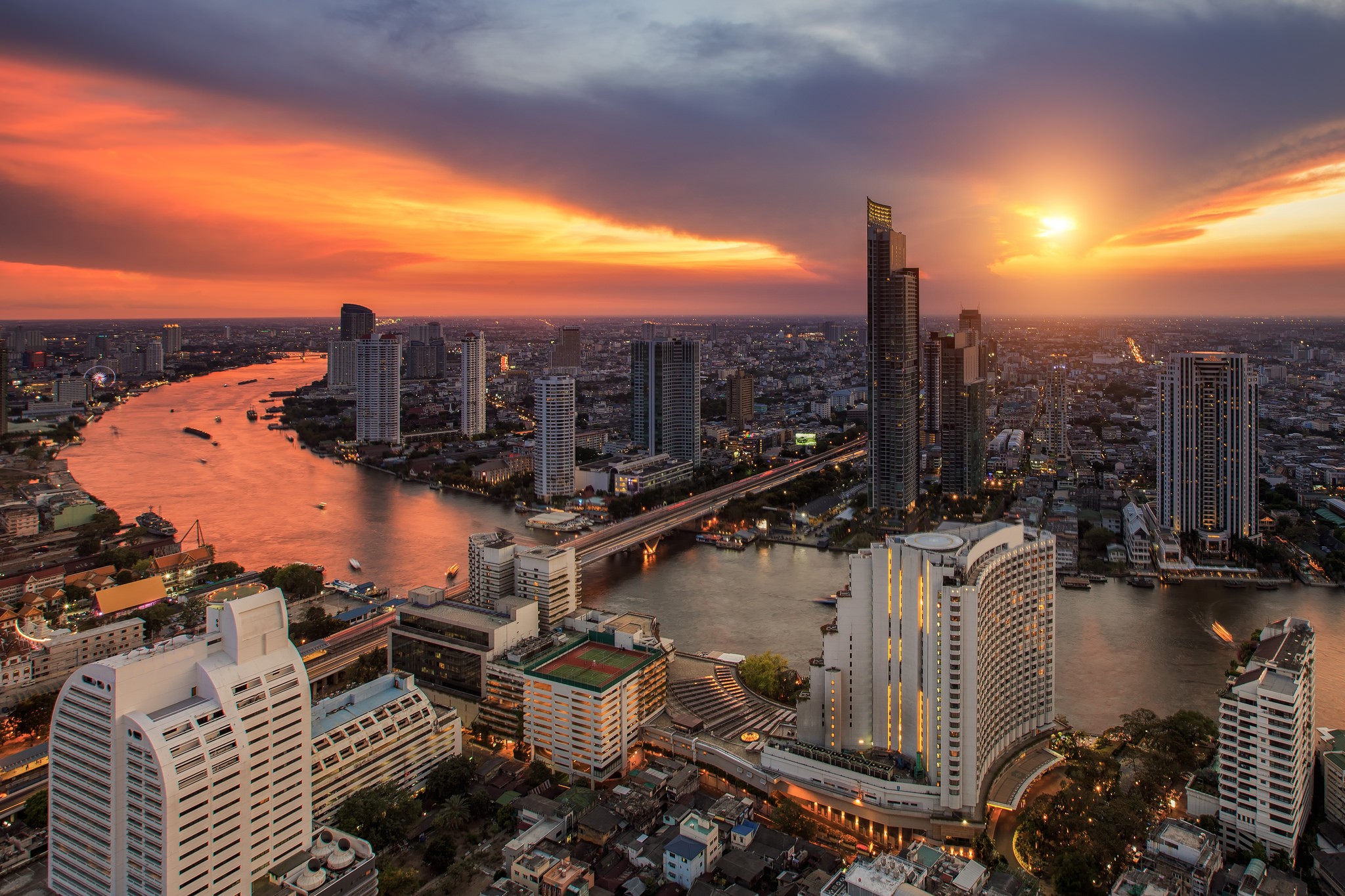Bangkok skyline at sunset over the Chao Phraya River HD Wallpaper
