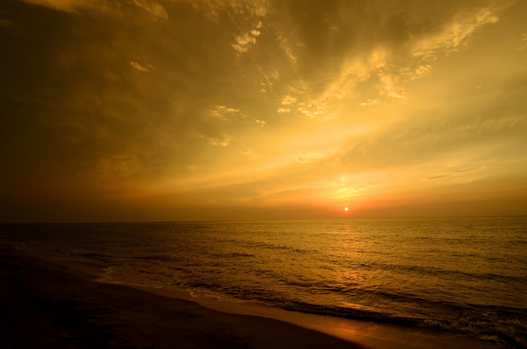 Sunset over the ocean with clouds and beach HD Wallpaper