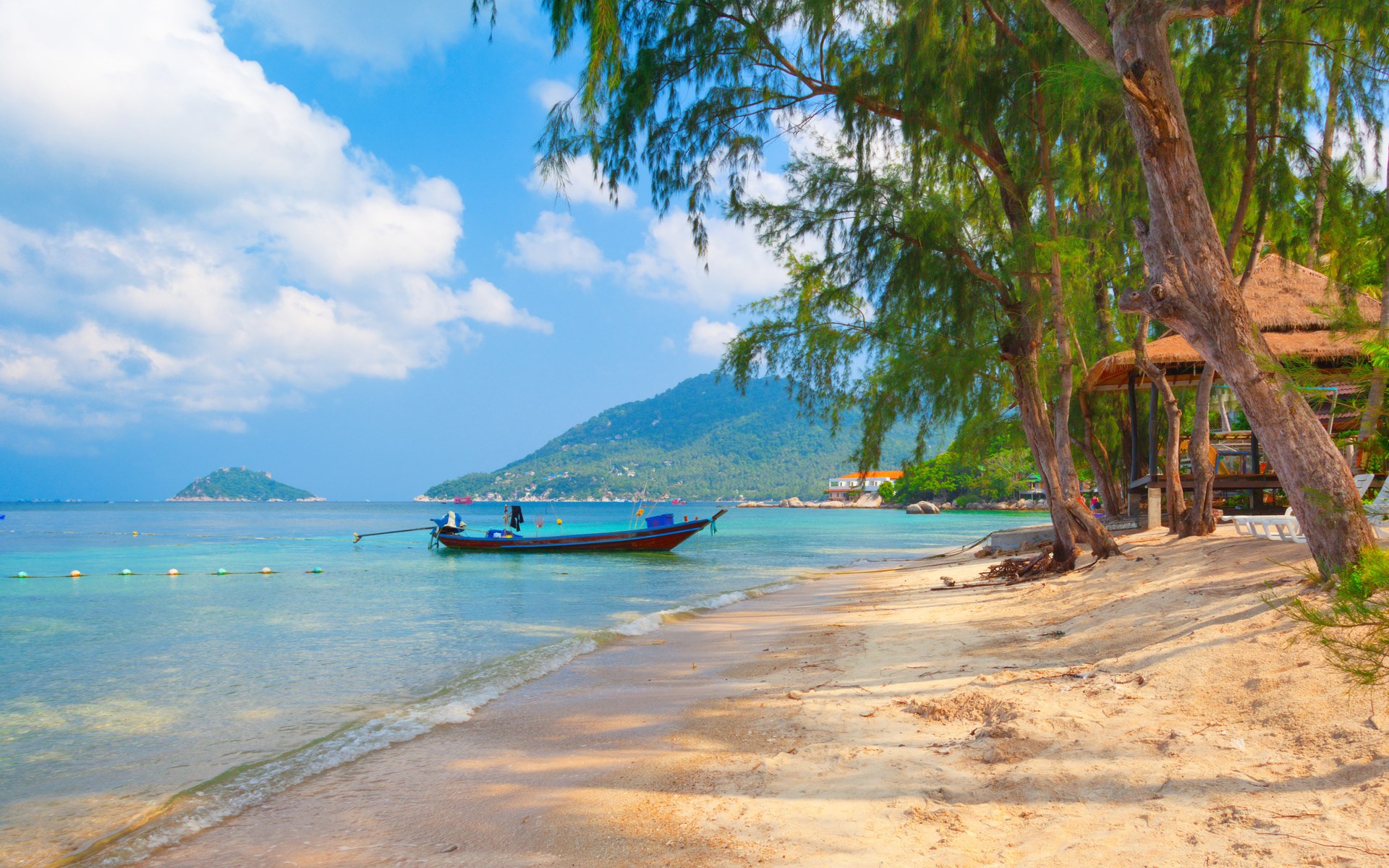 Tropical beach with a boat and a hut HD Wallpaper