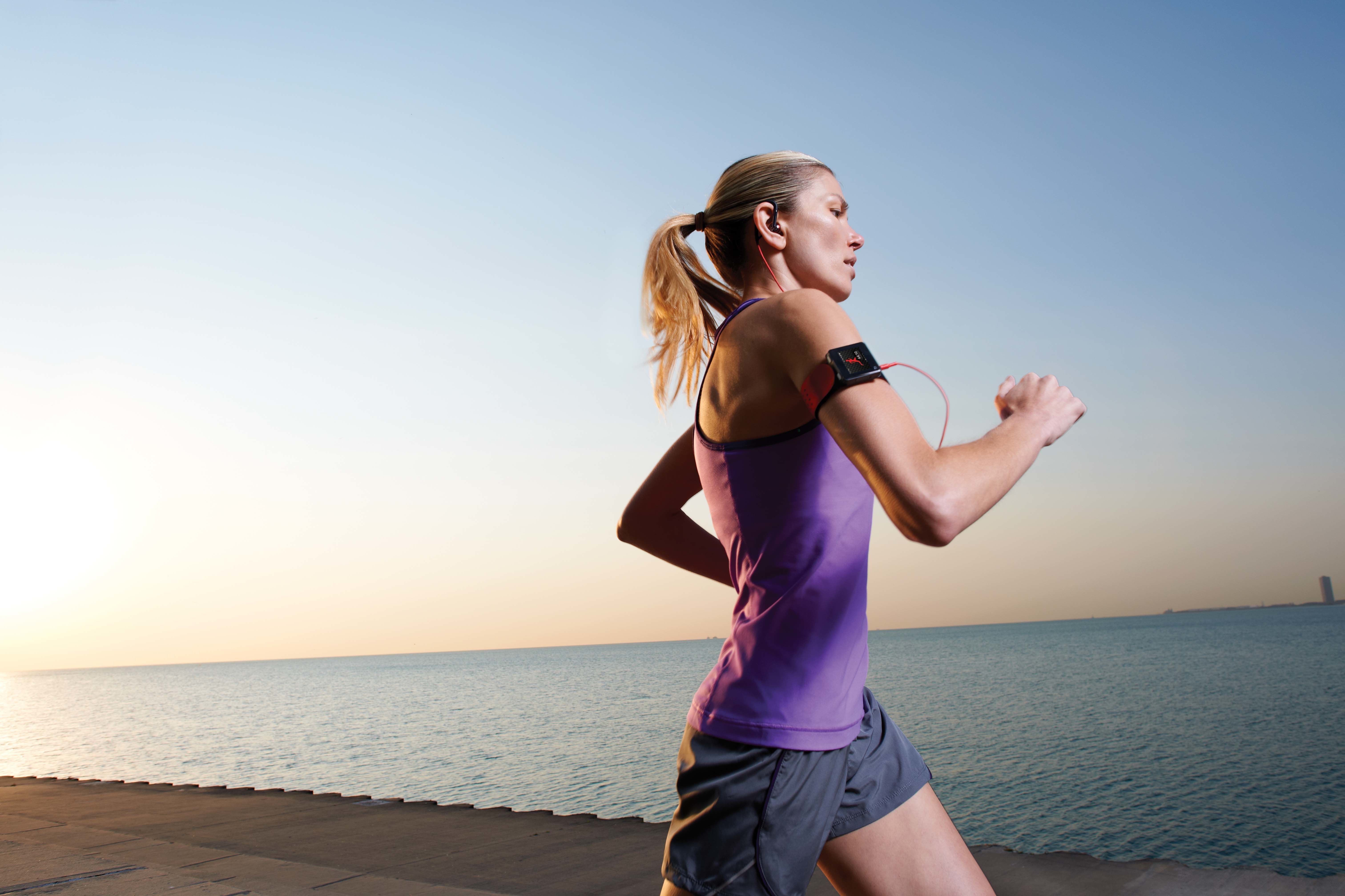Woman running by the sea at sunrise HD Wallpaper