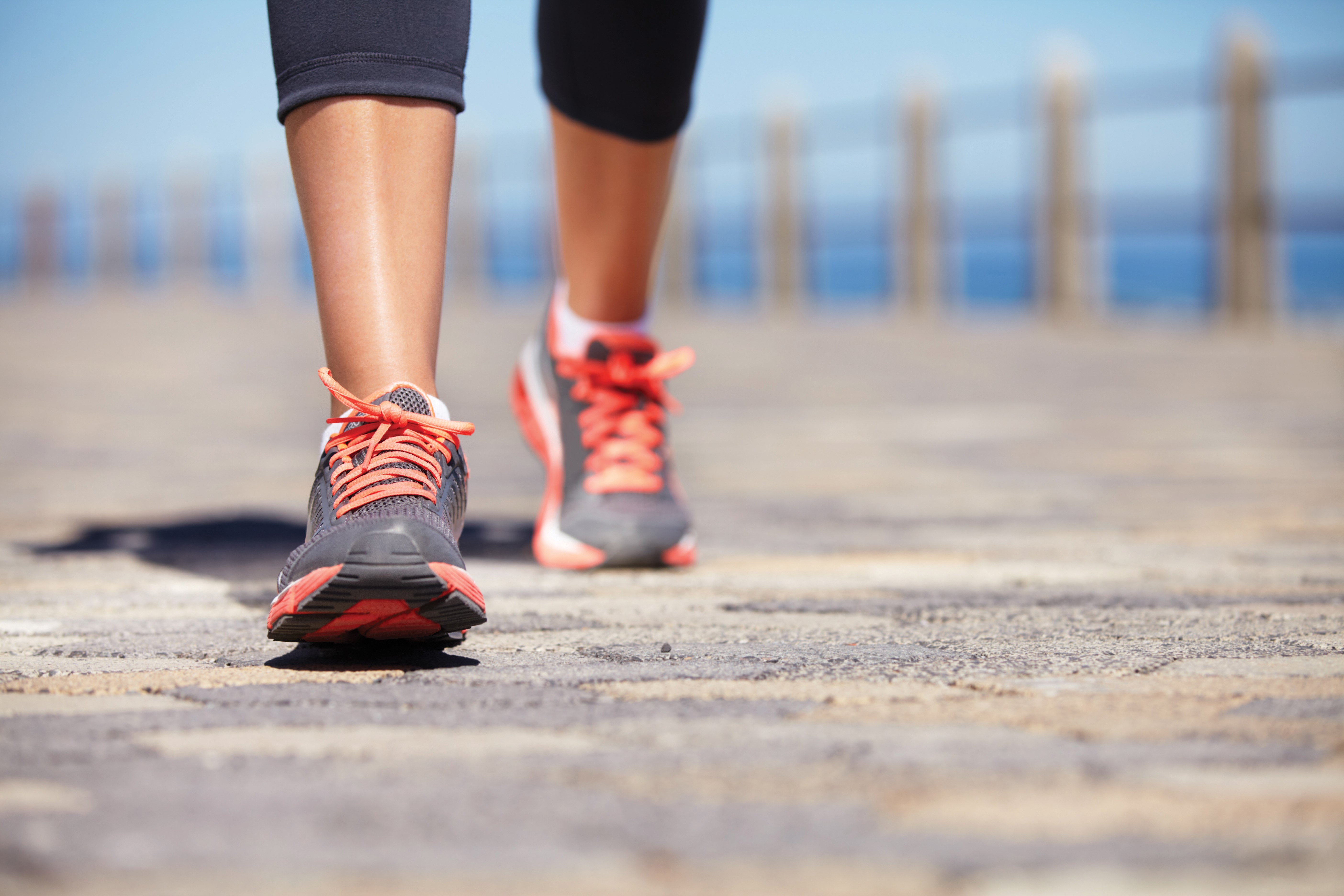 Close-up of athletic shoes and legs walking HD Wallpaper